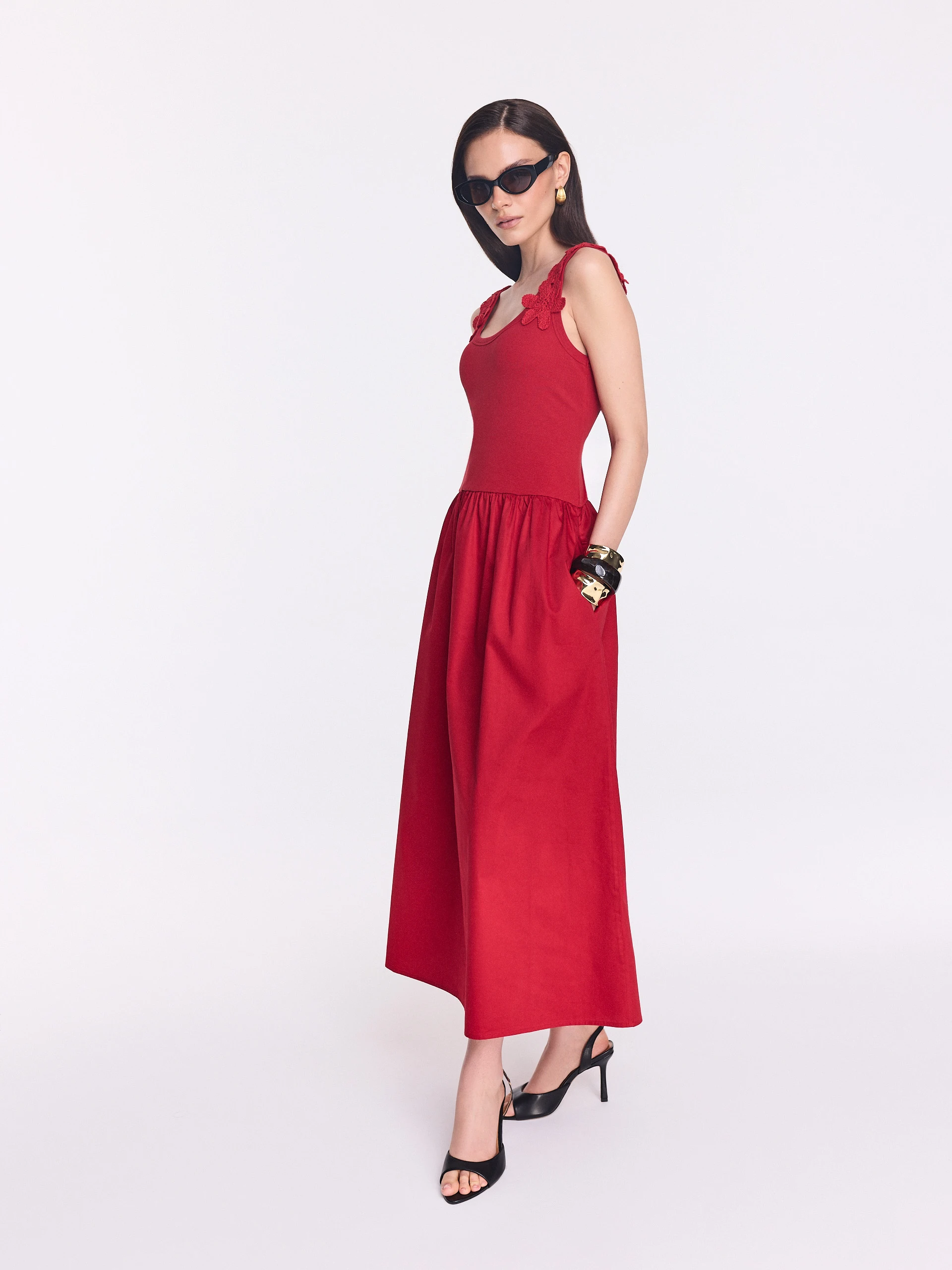 Red midi dress with decorative straps