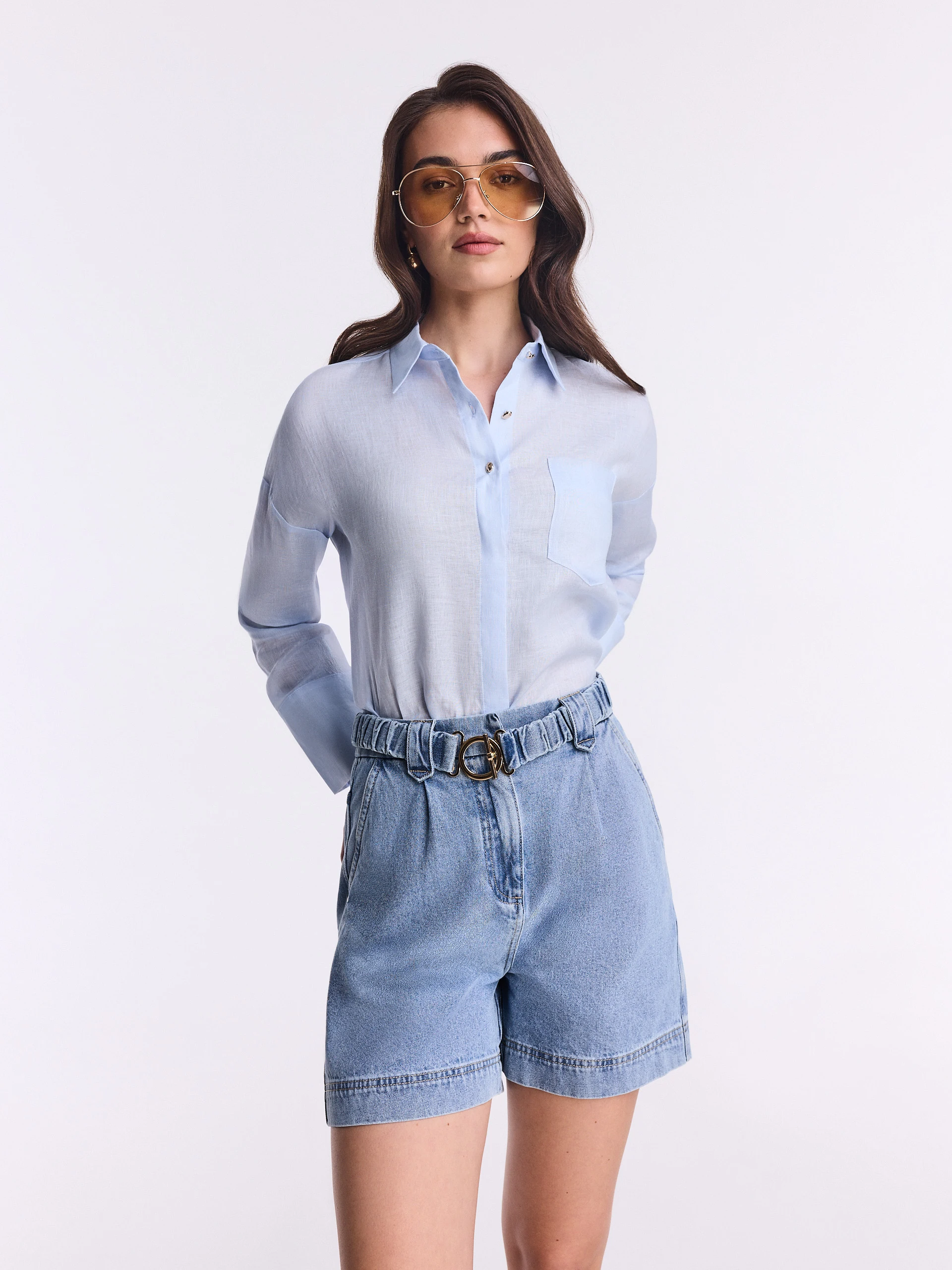 Light-colored high-waisted denim shorts