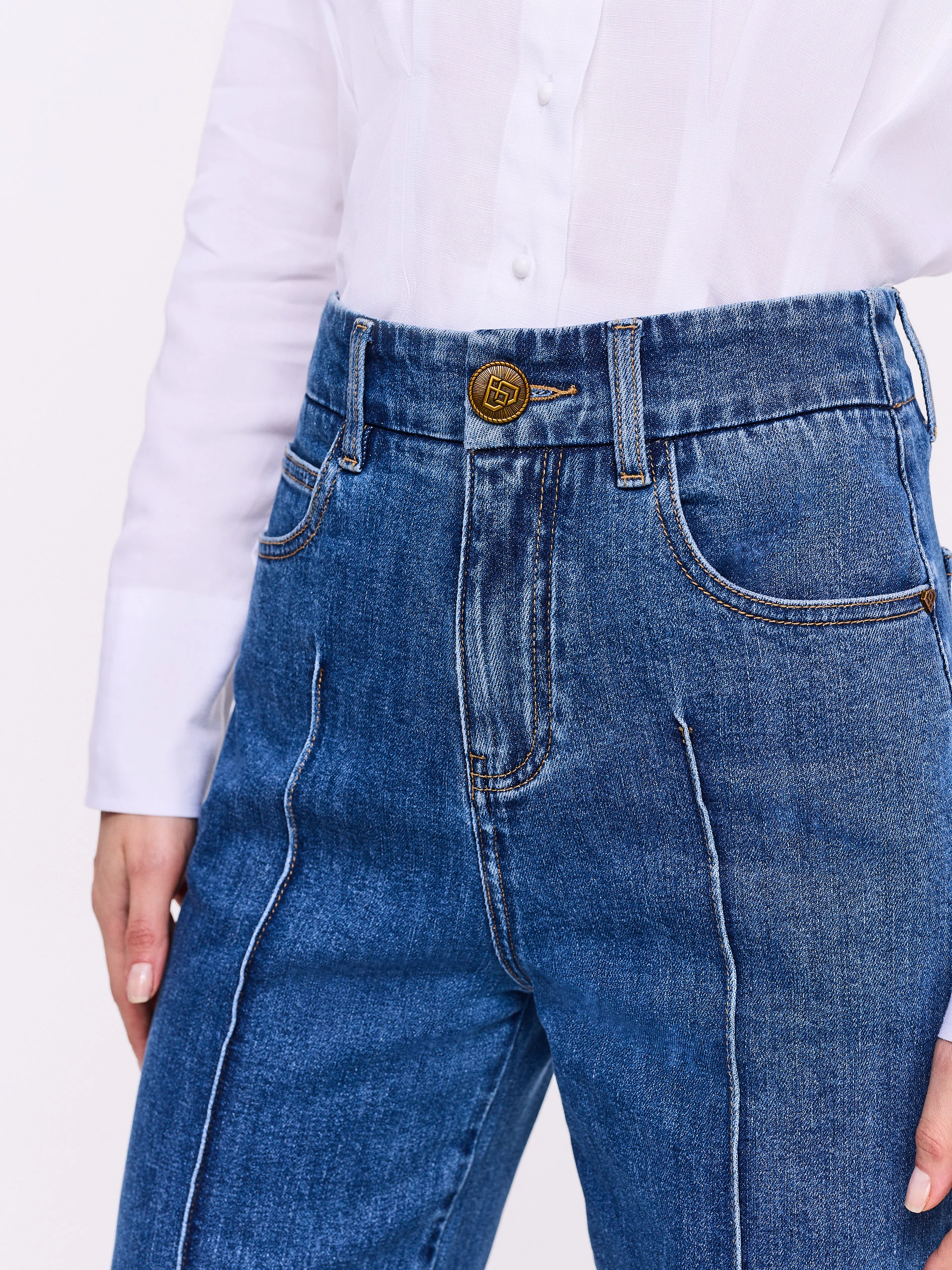 High-waisted jeans with decorative stitching