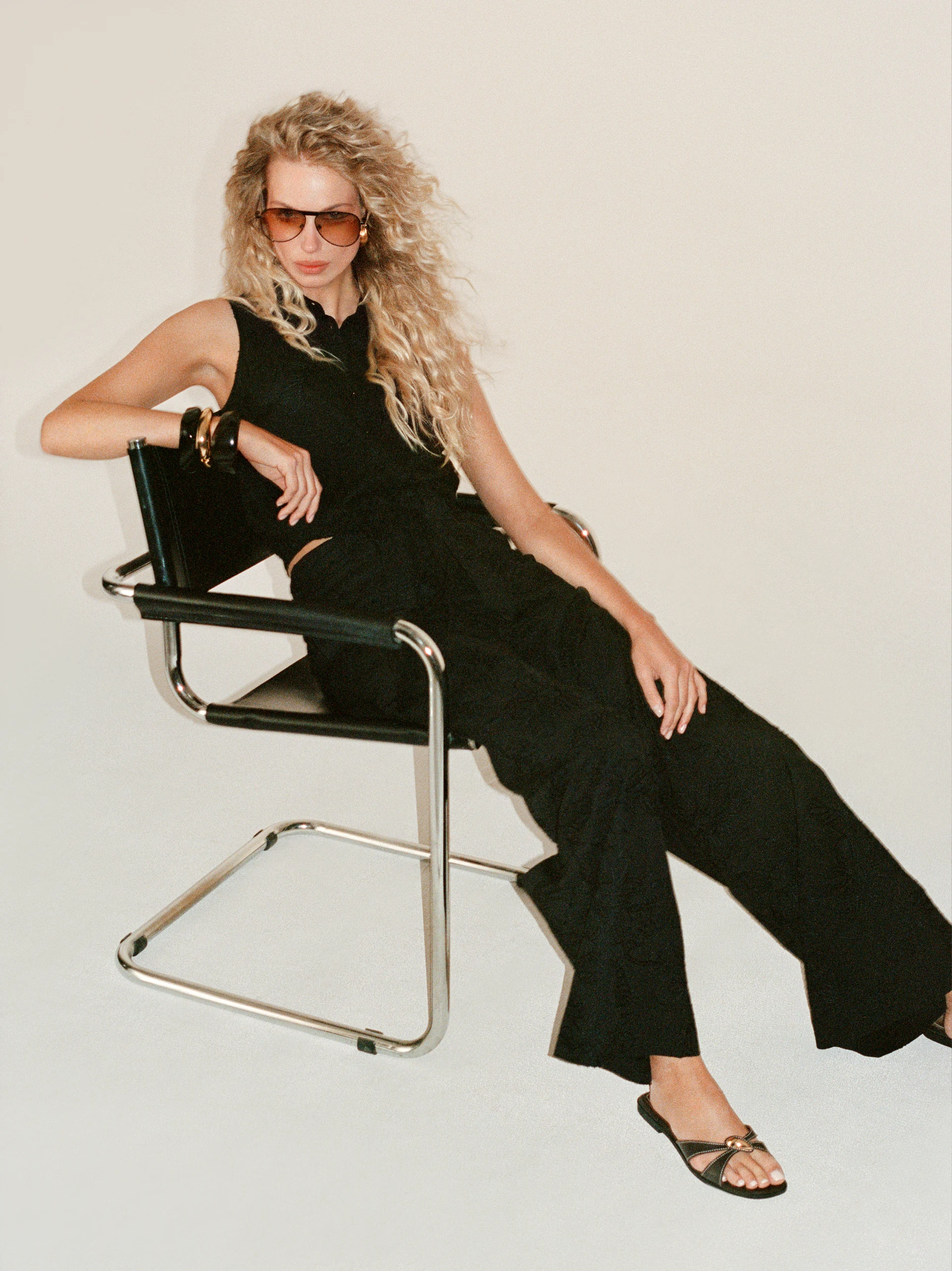 Black wide-leg pants with floral embroidery