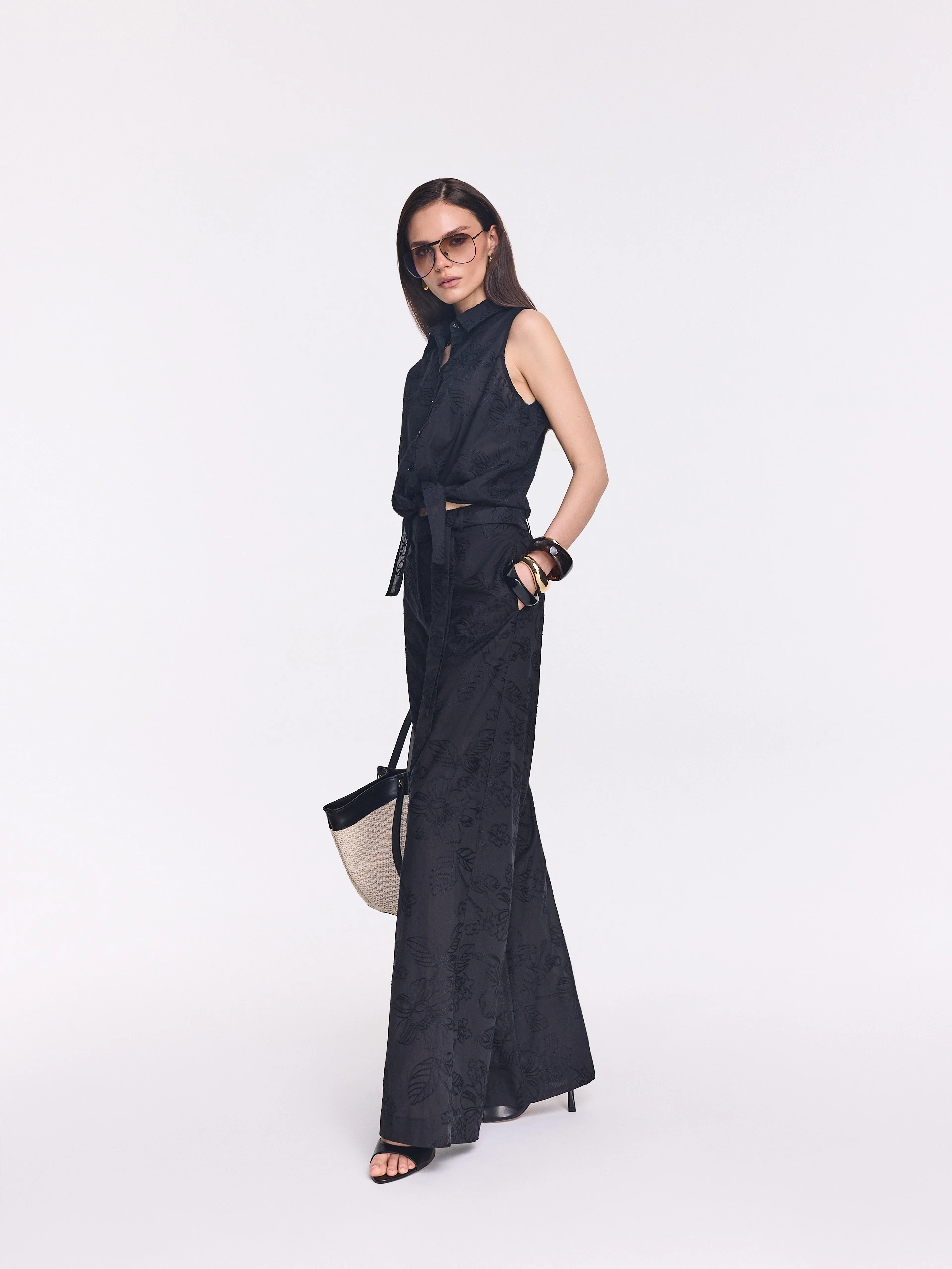 Black wide-leg pants with floral embroidery