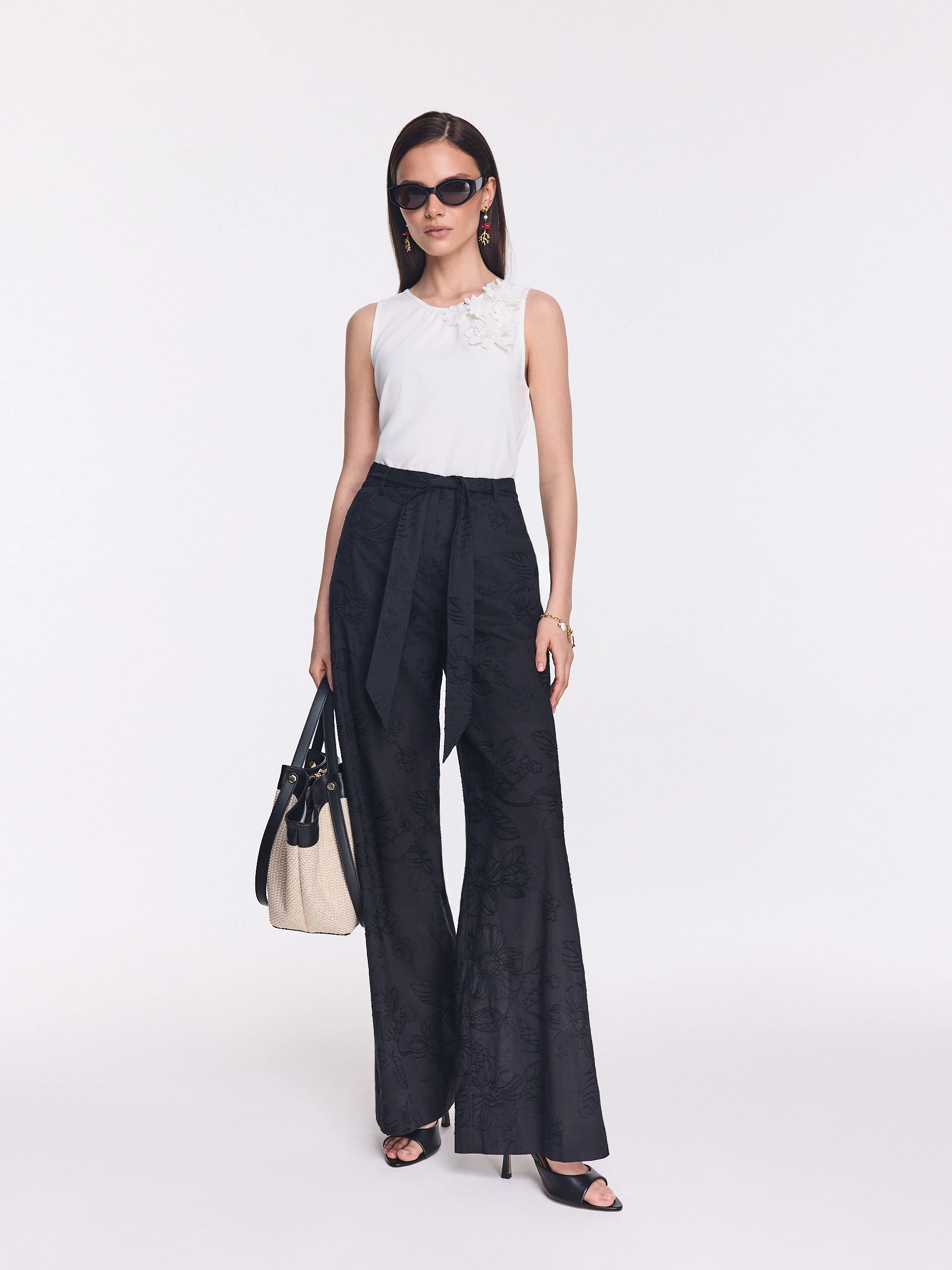 Black wide-leg pants with floral embroidery