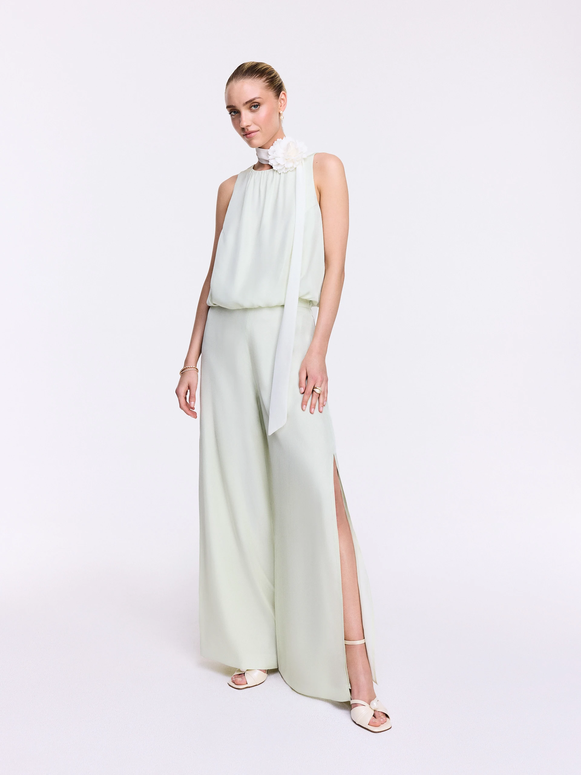 Wide-leg pants with a slit in a pastel mint shade