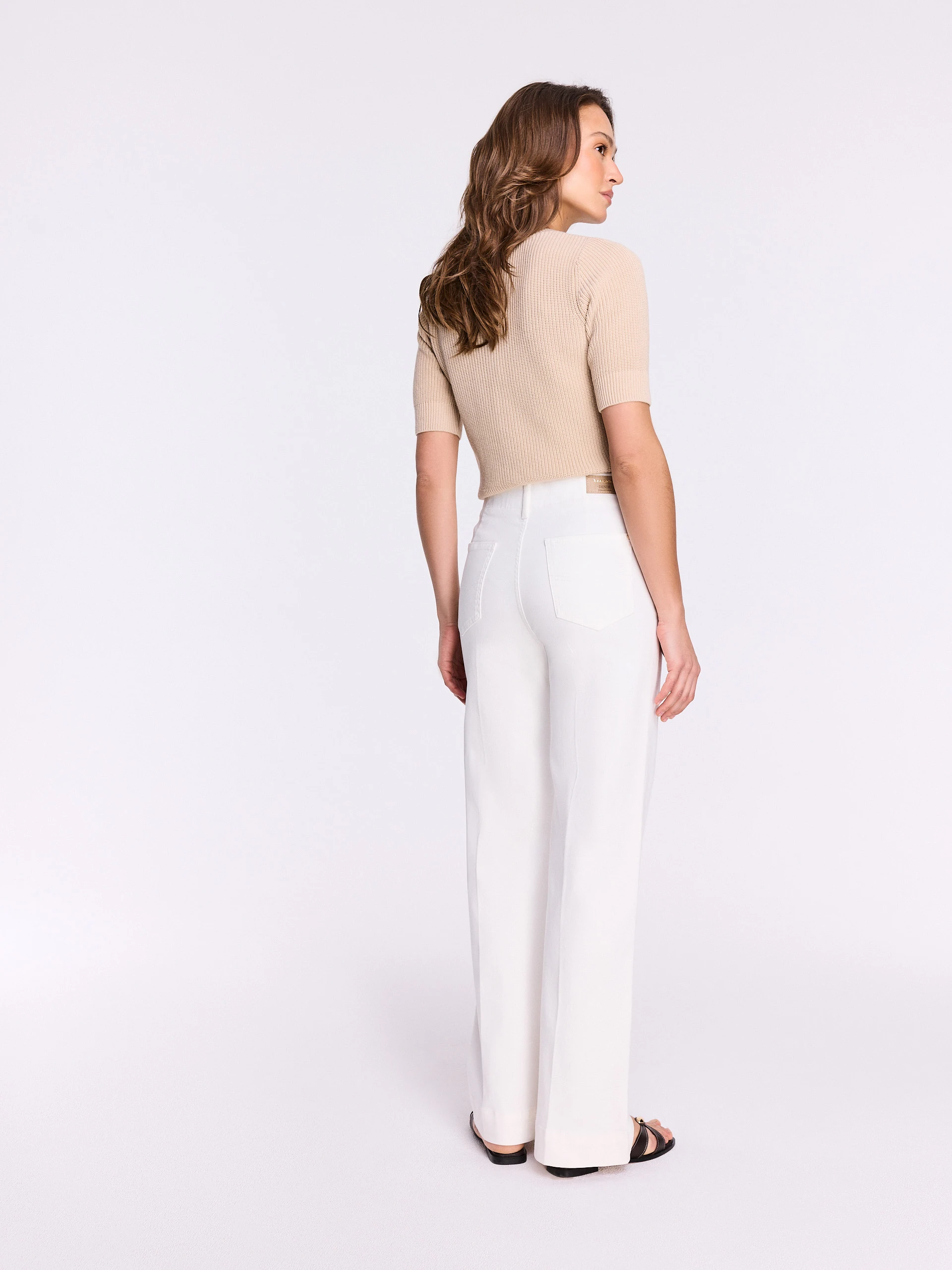 White high-waisted jeans with straight legs