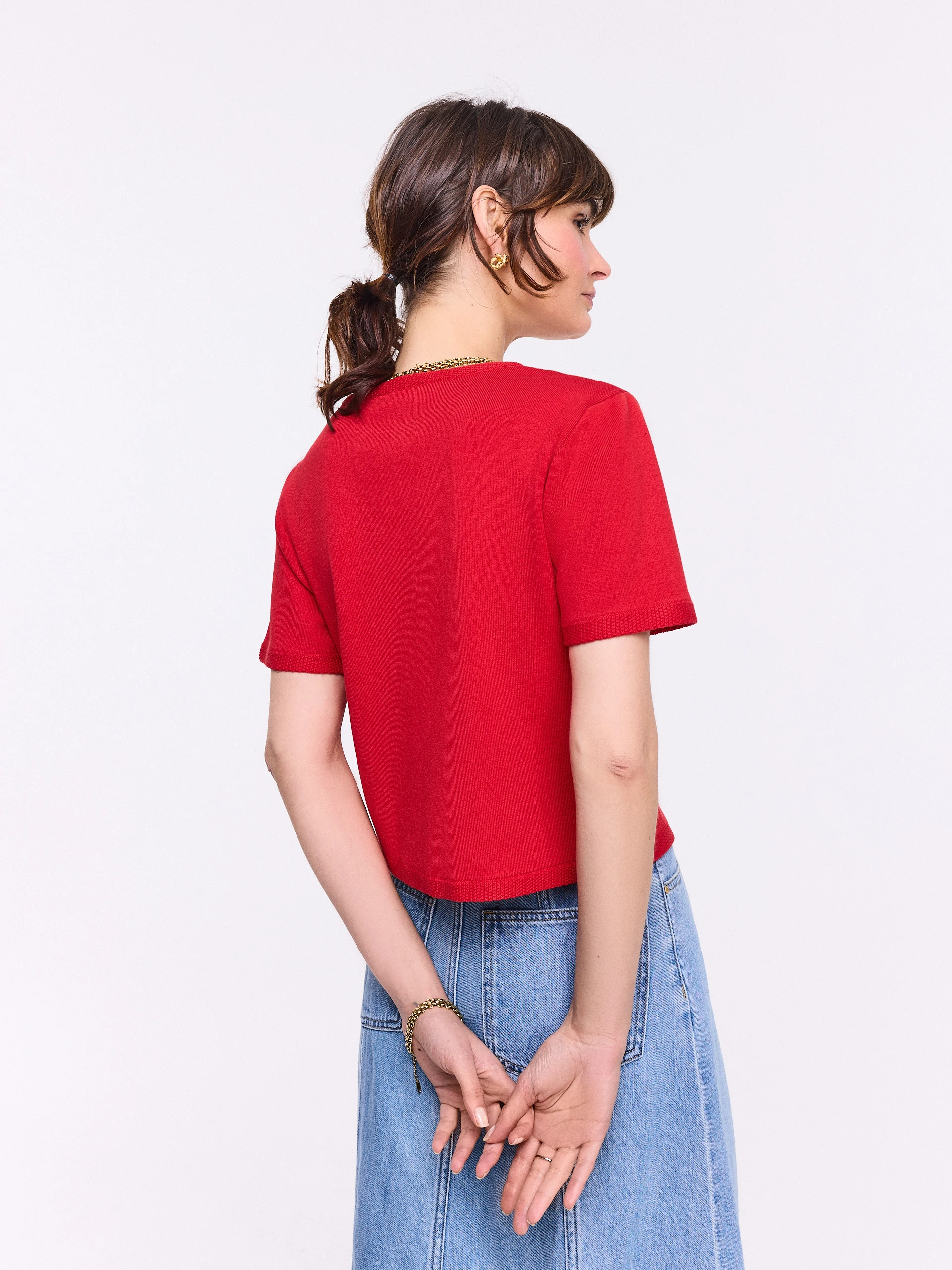 Red sweater with decorative buttons