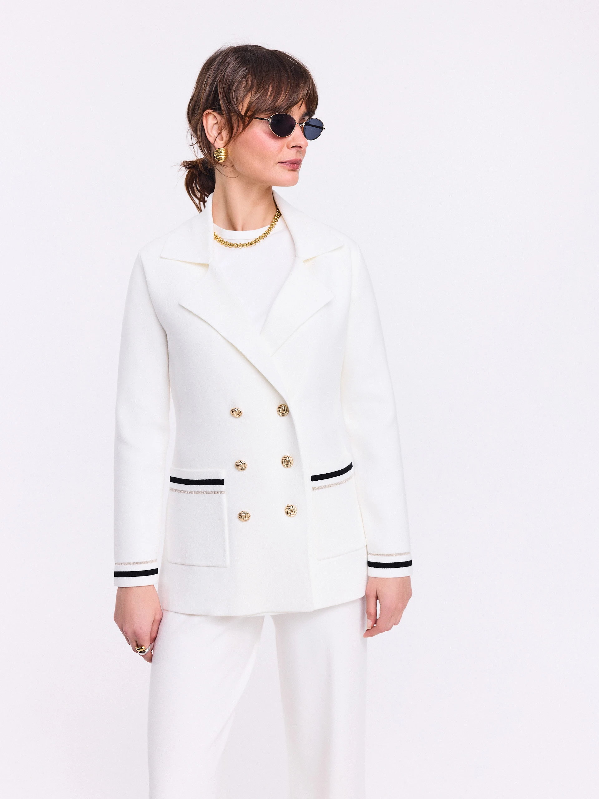 Cream double-breasted jacket with decorative piping