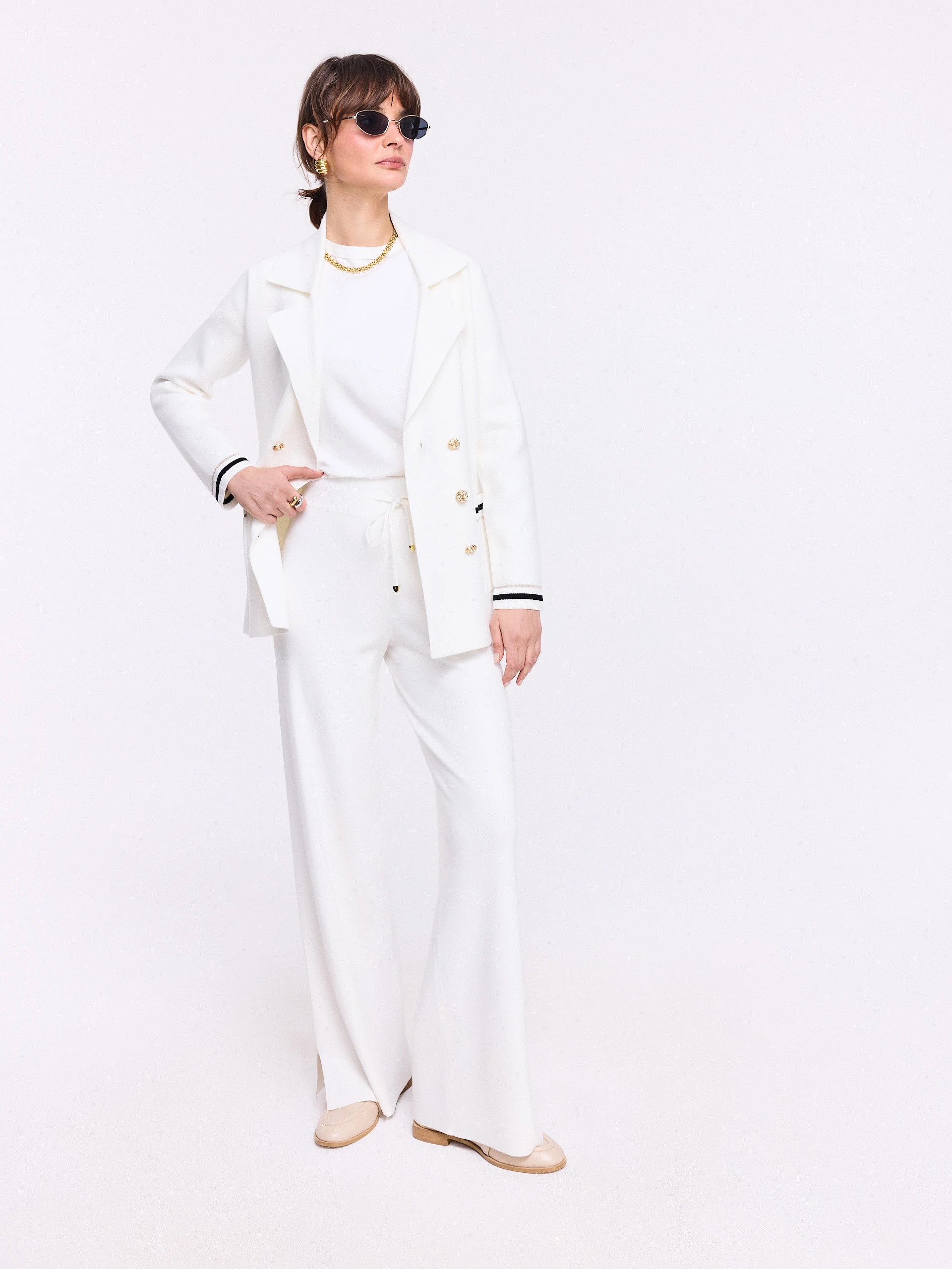 Cream double-breasted jacket with decorative piping