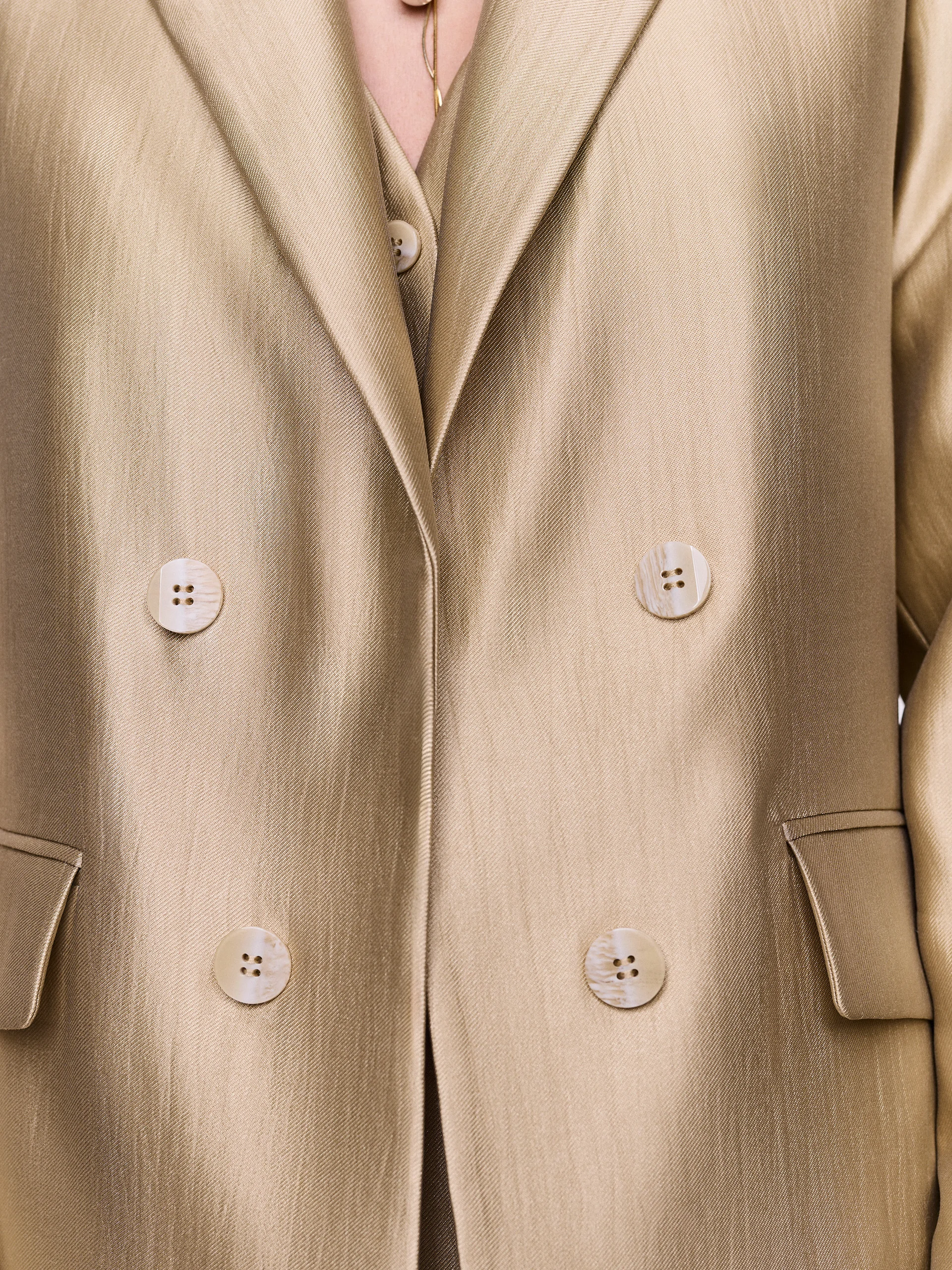 A gold-toned blazer