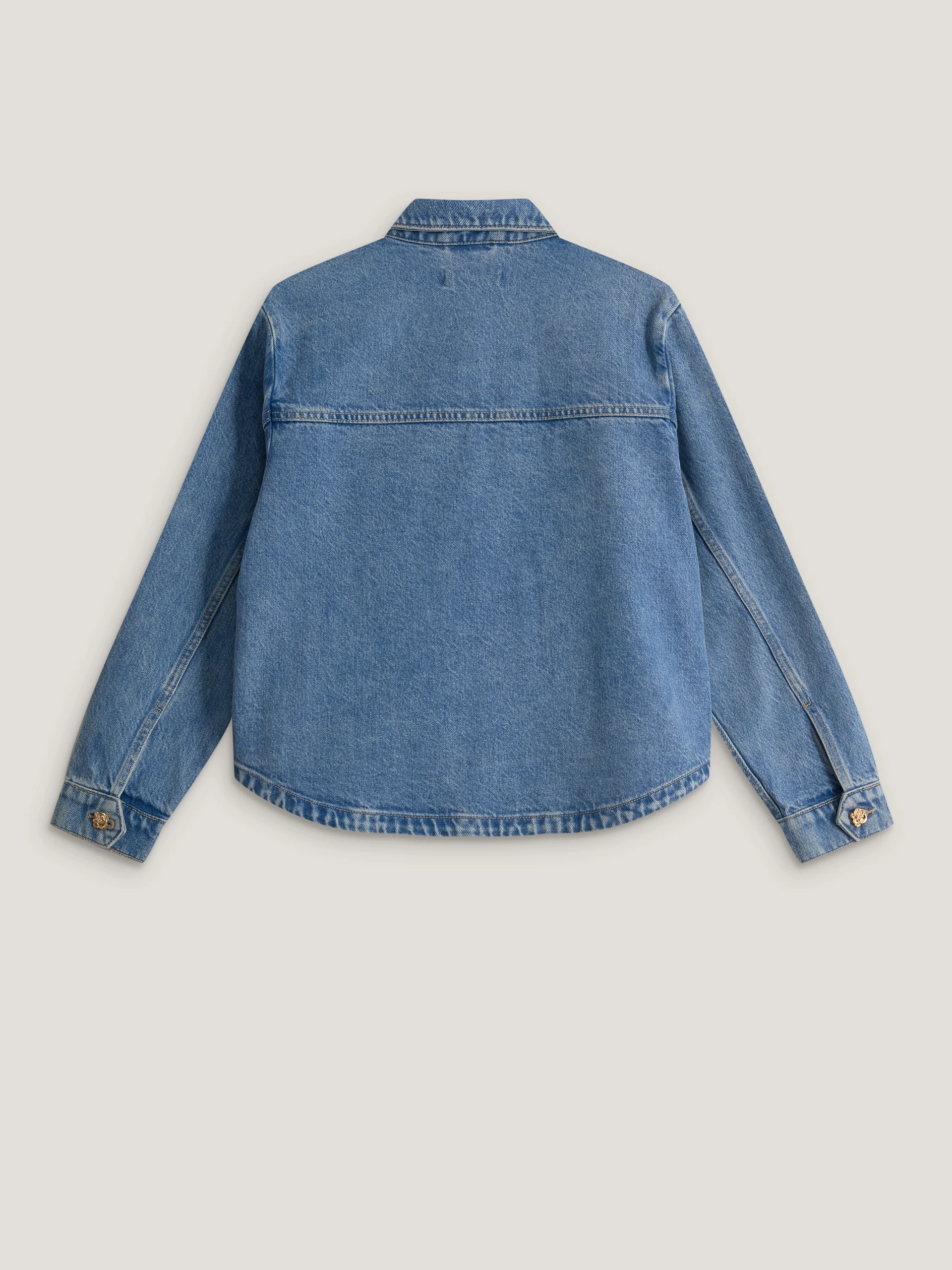Denim jacket with decorative buttons