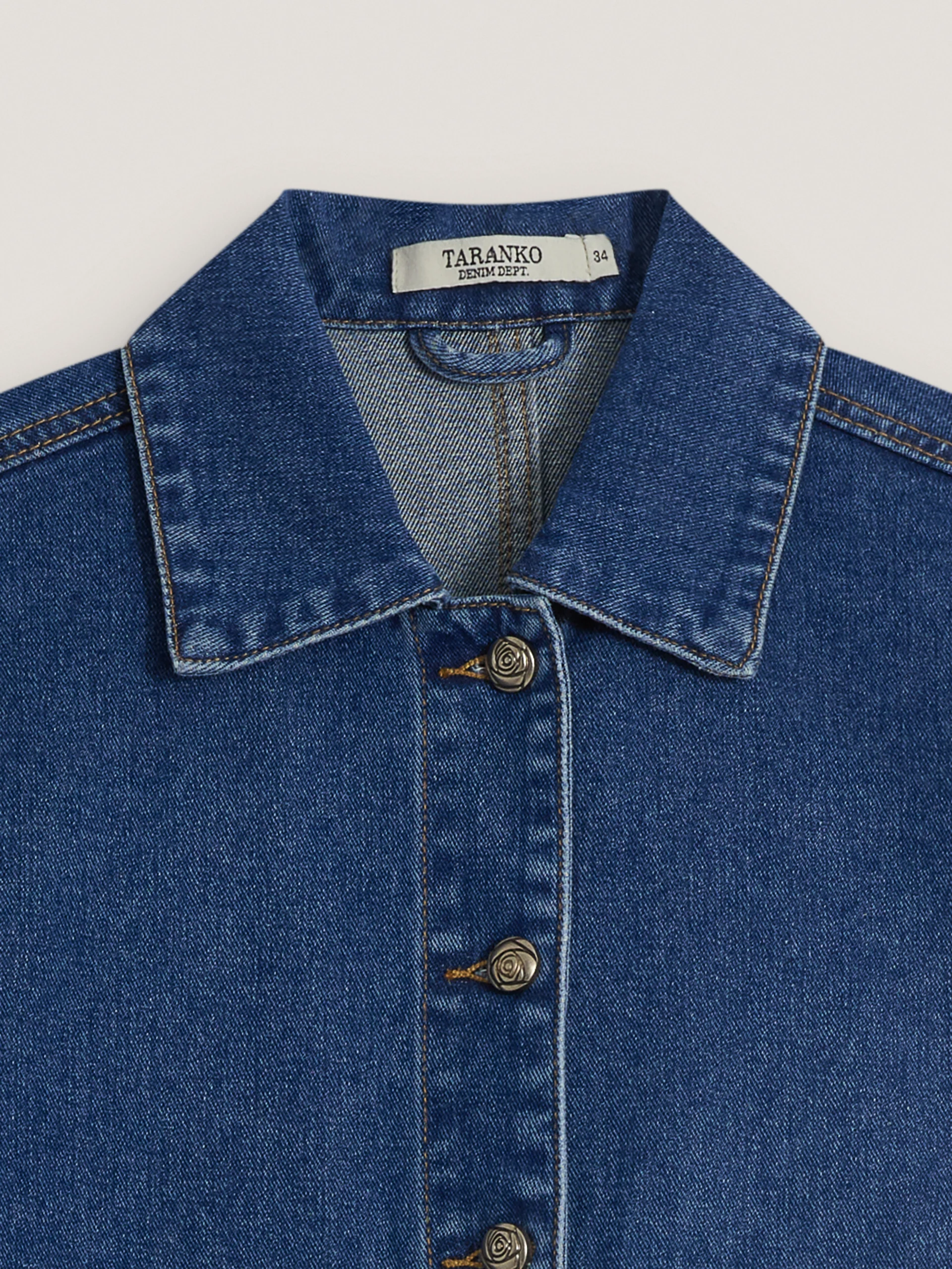 Denim jacket with decorative buttons