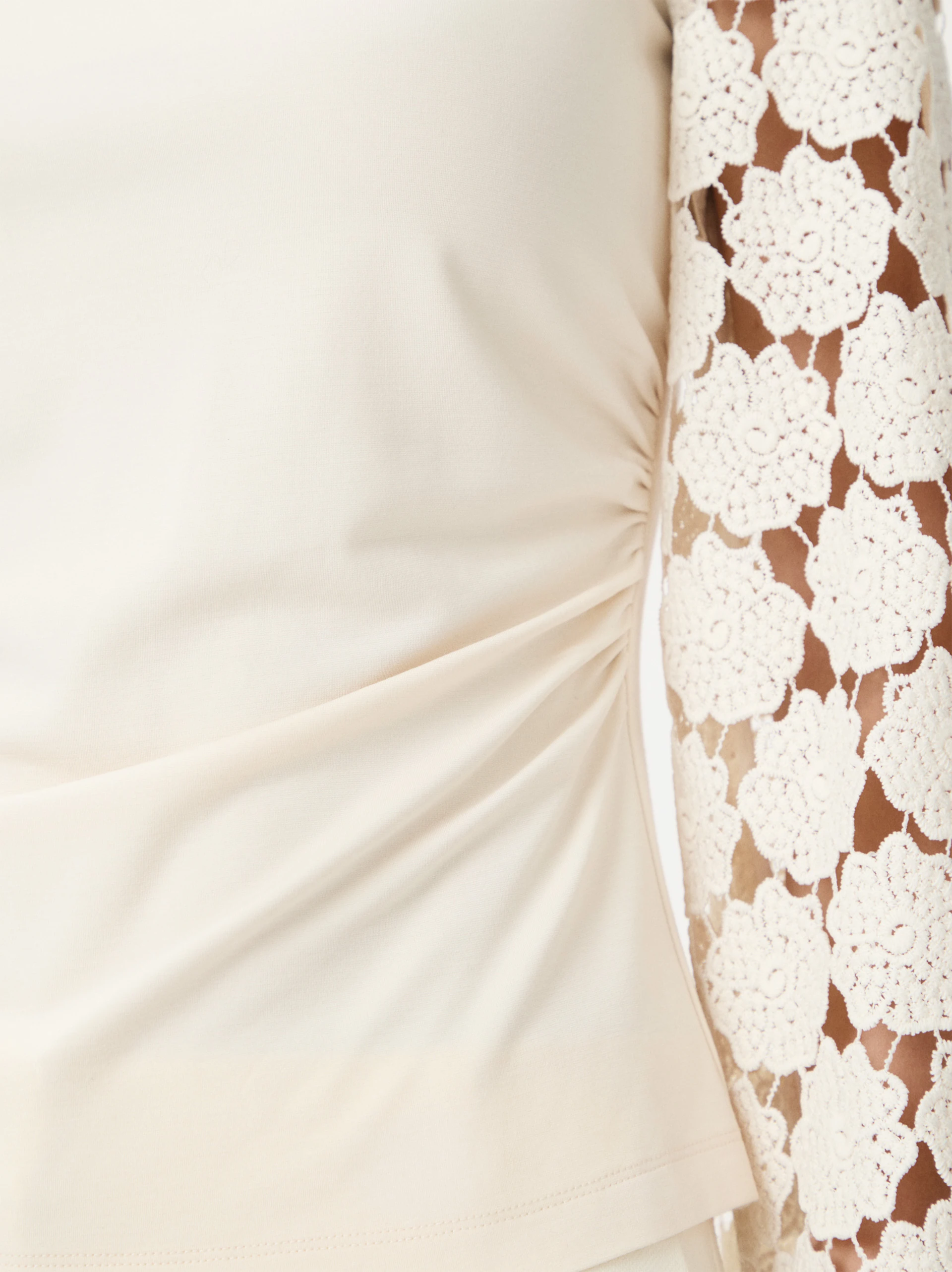 Cream blouse with lace sleeves