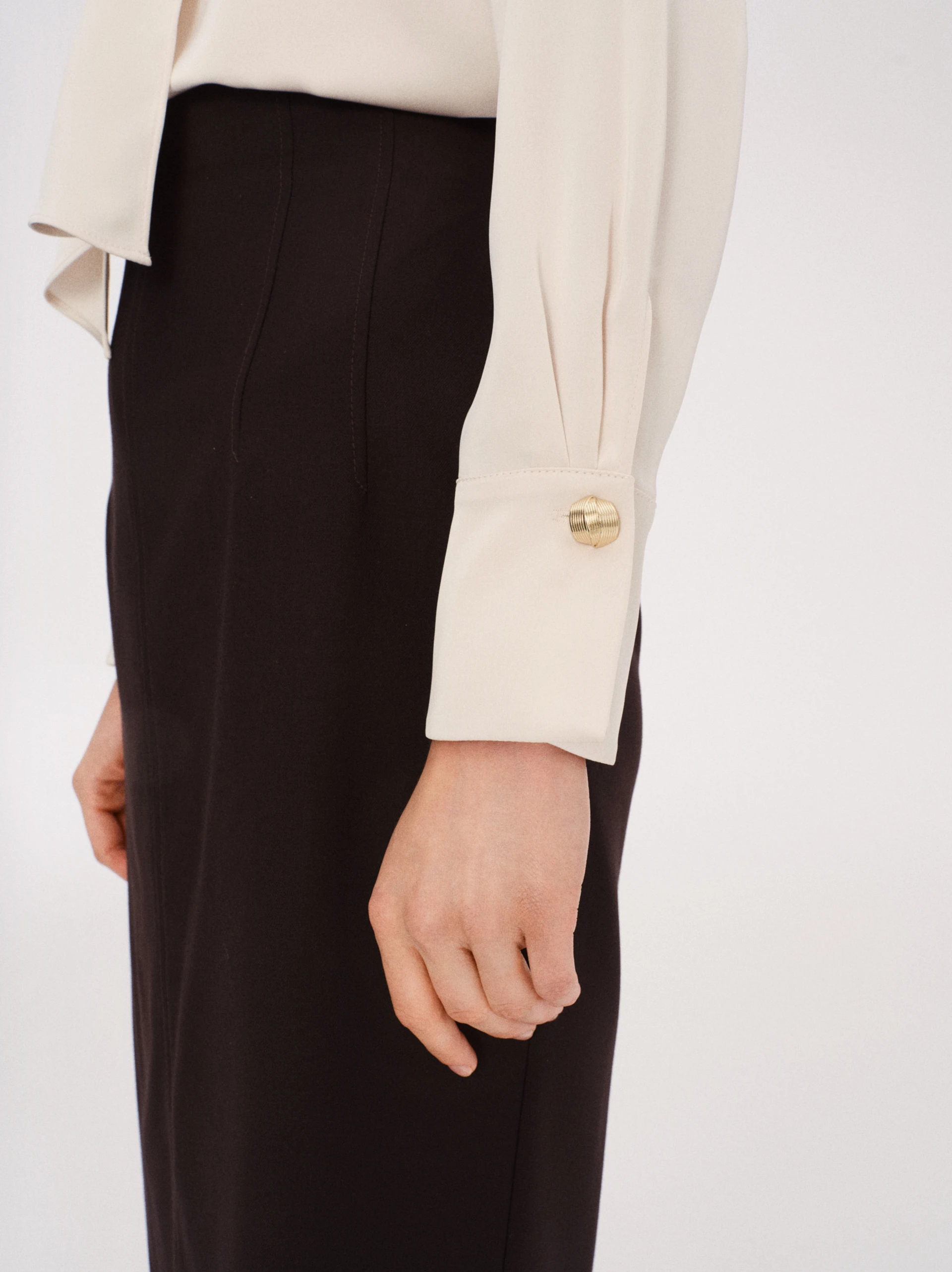 Cream blouse with a tie at the neck