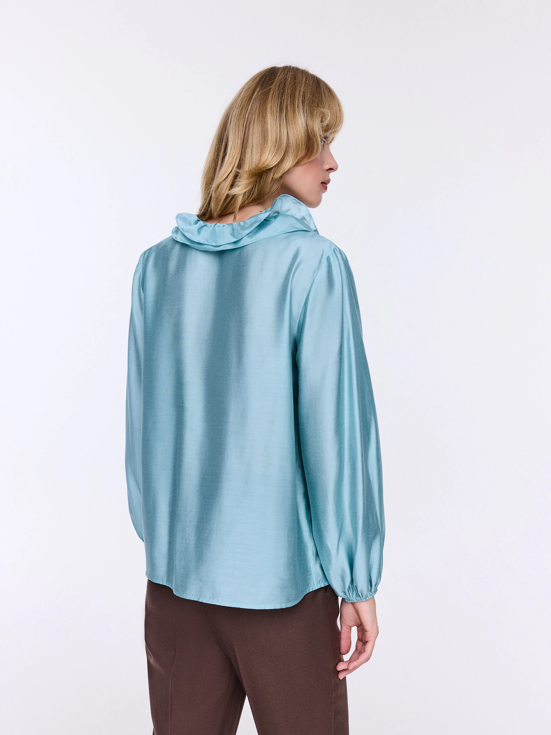 Blue shirt with frills and puffed sleeves