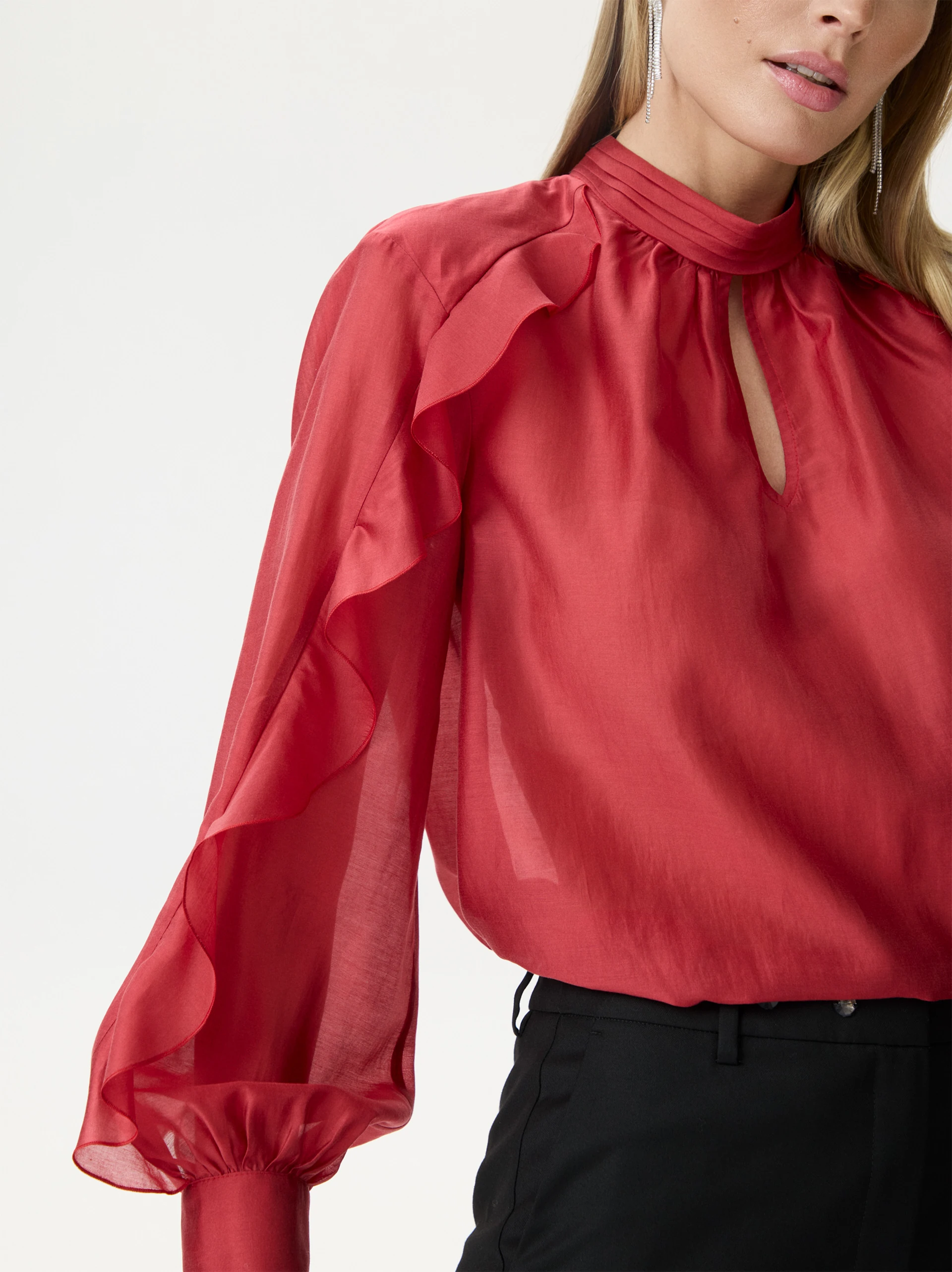 Red satin blouse with decorative ruffles