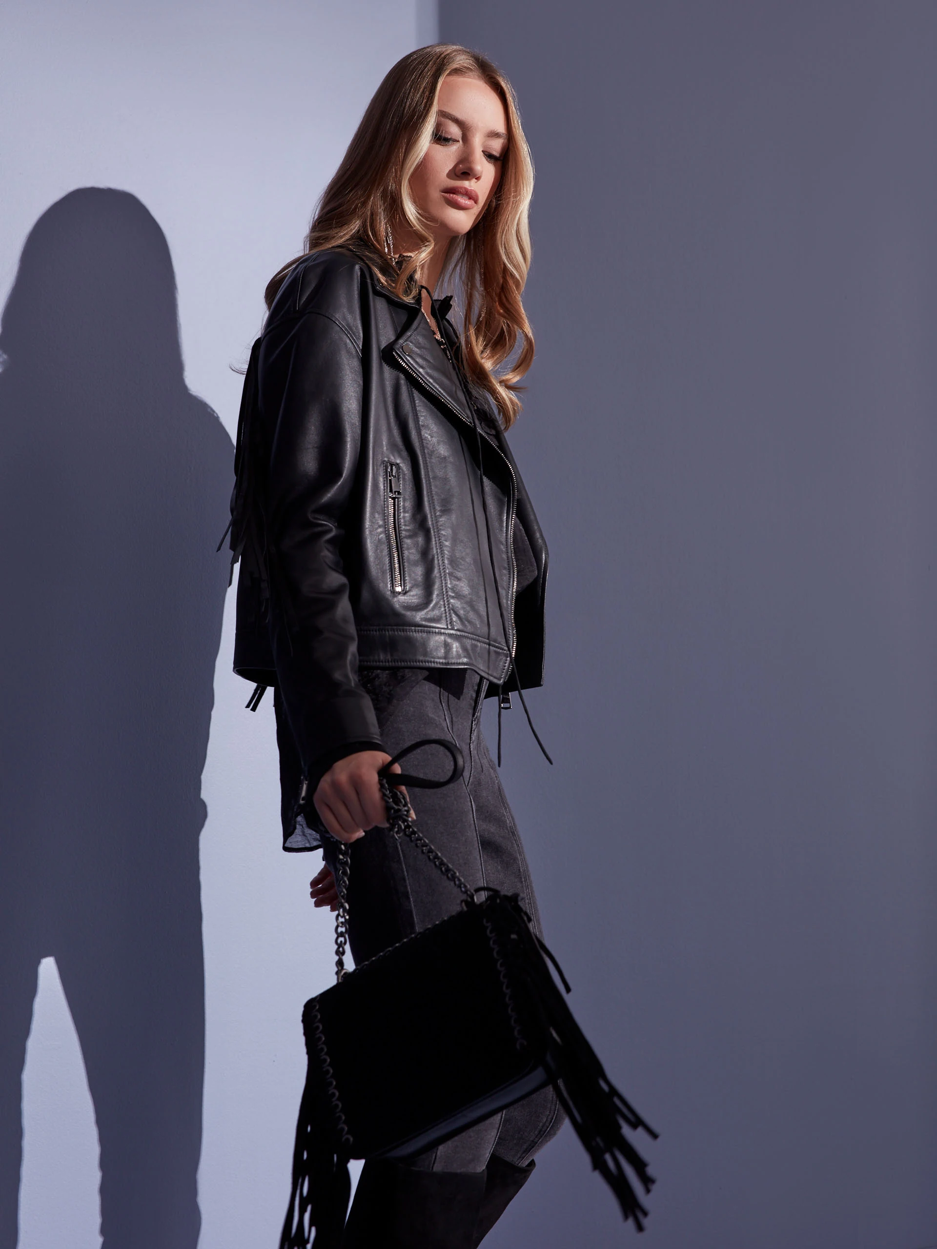 BLACK LEATHER RAMONESKI WITH TASSELS