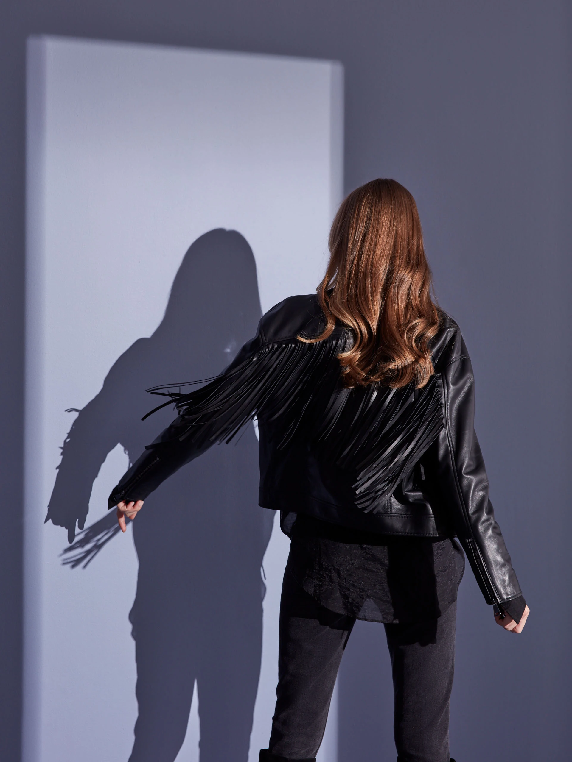 BLACK LEATHER RAMONESKI WITH TASSELS