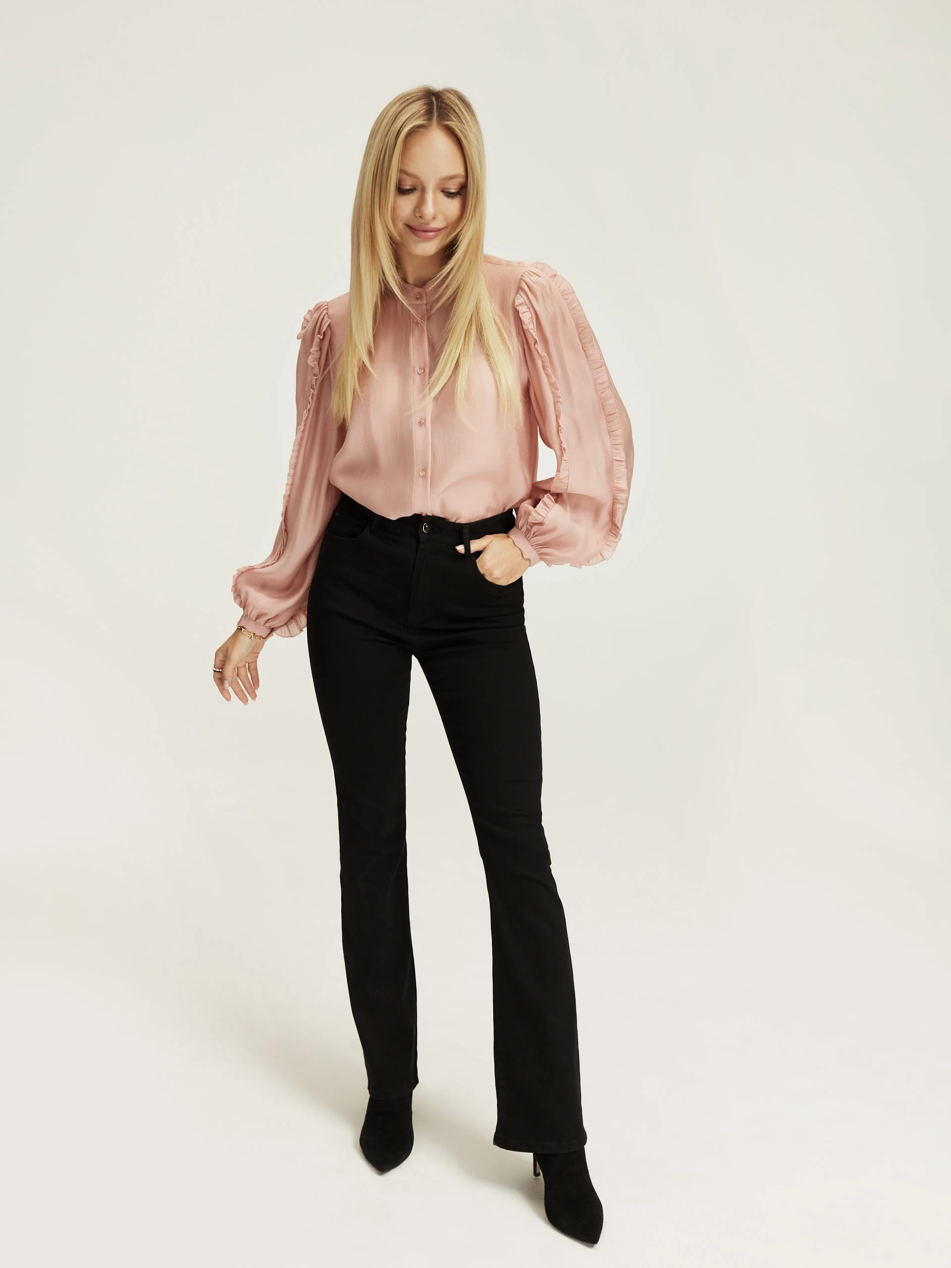 Pink blouse with ruffles on the sleeves