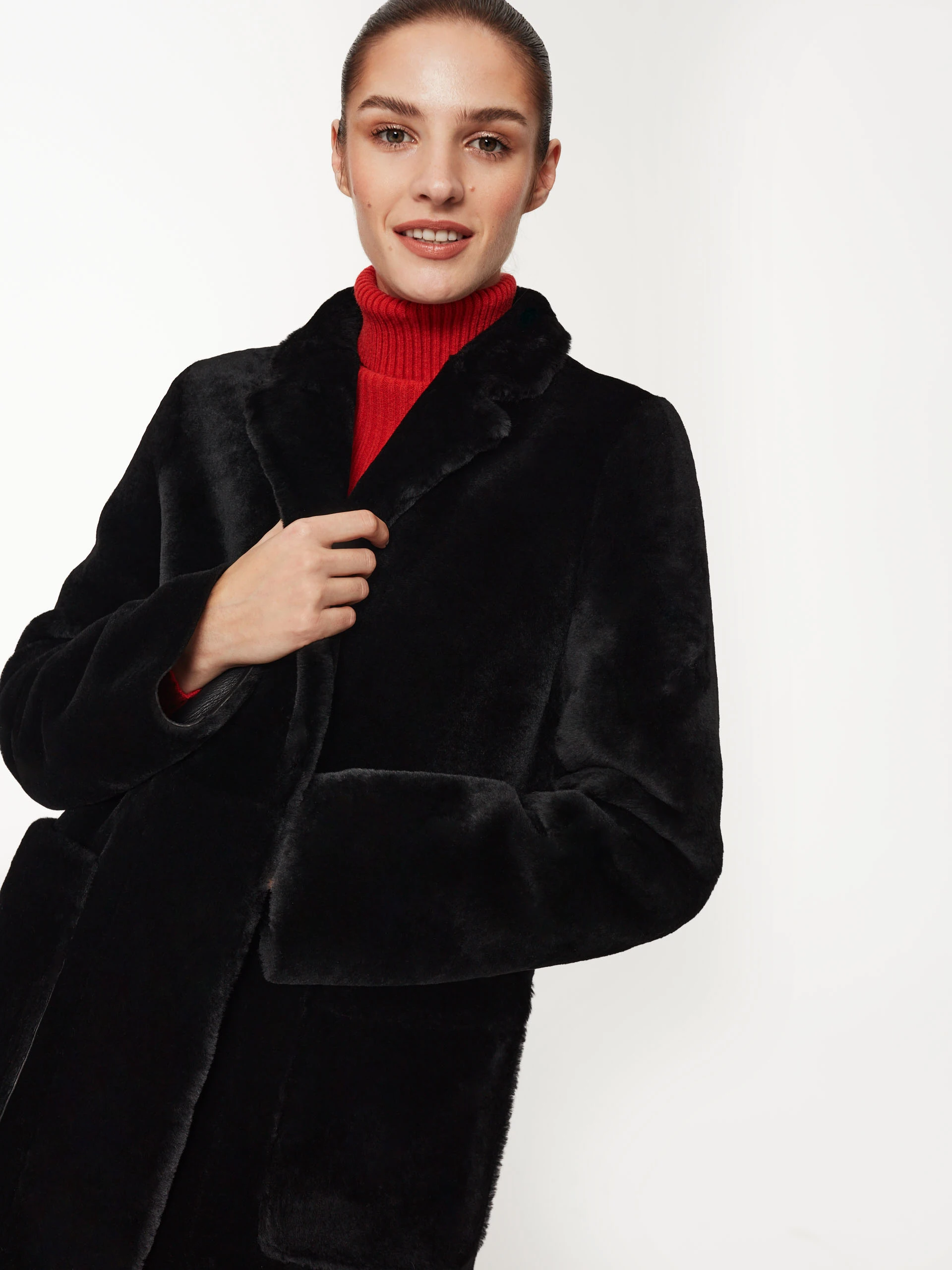 Black sheepskin coat with pockets