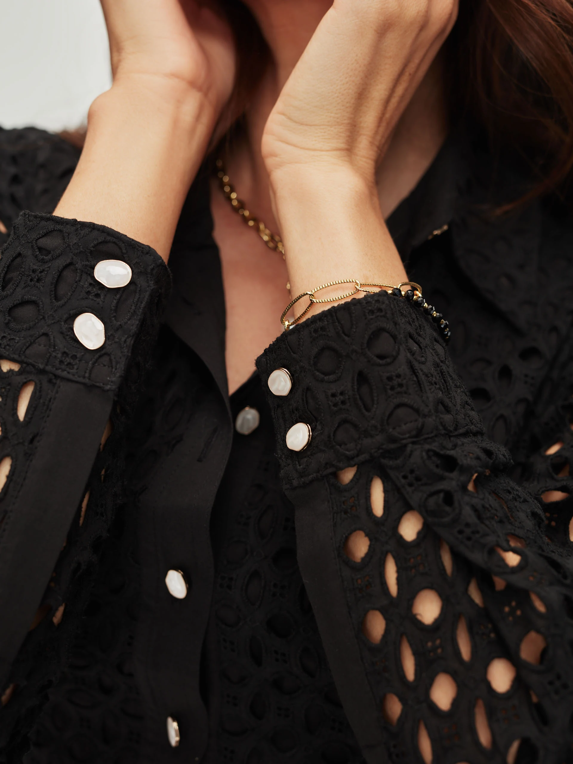 Black openwork dress with patch pockets
