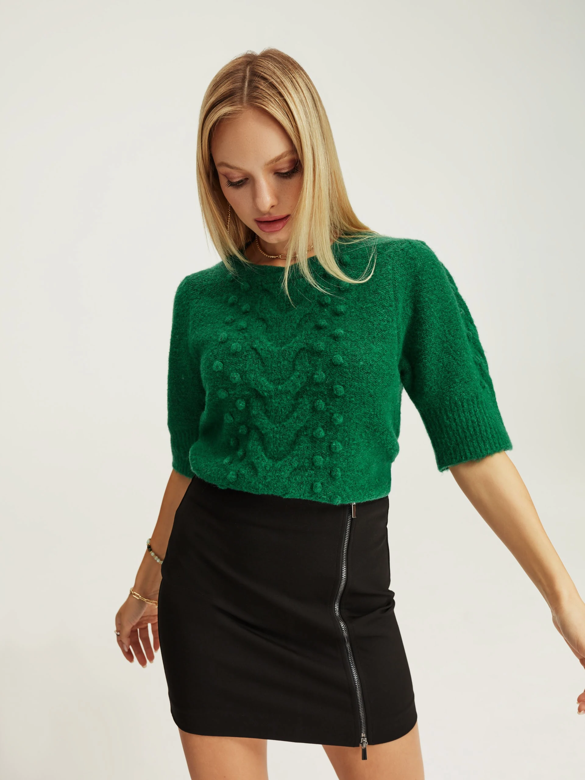 Green sweater with decorative weave