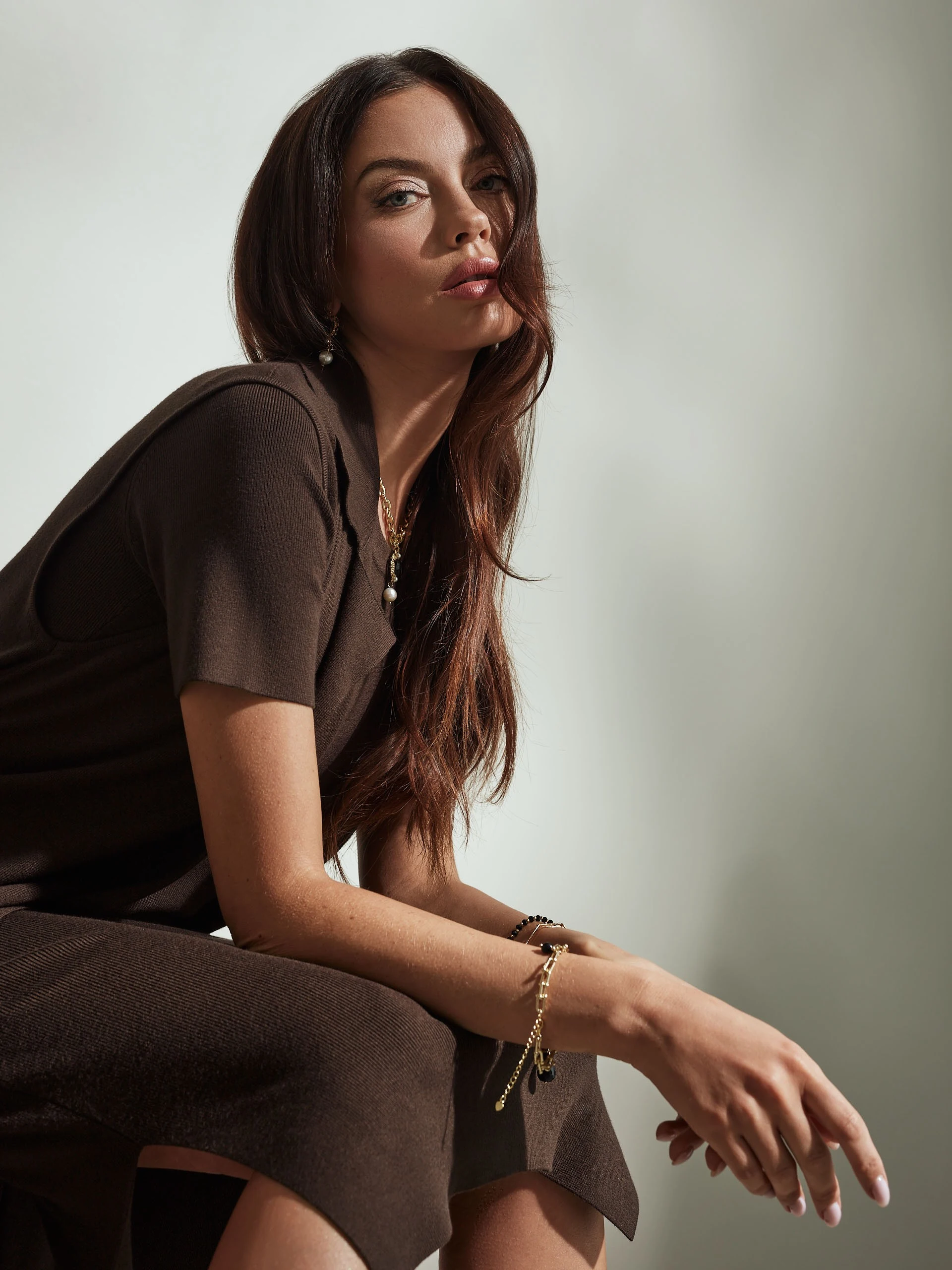 Long brown sleeveless sweater