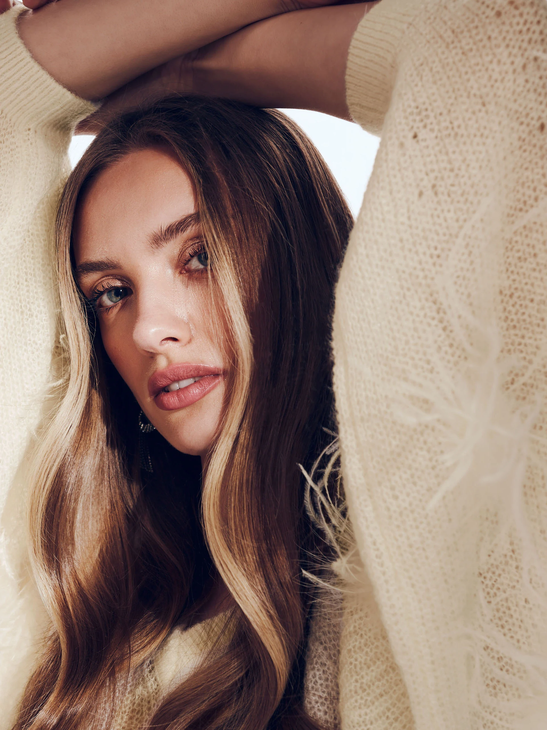 Beige sweater with ostrich feathers