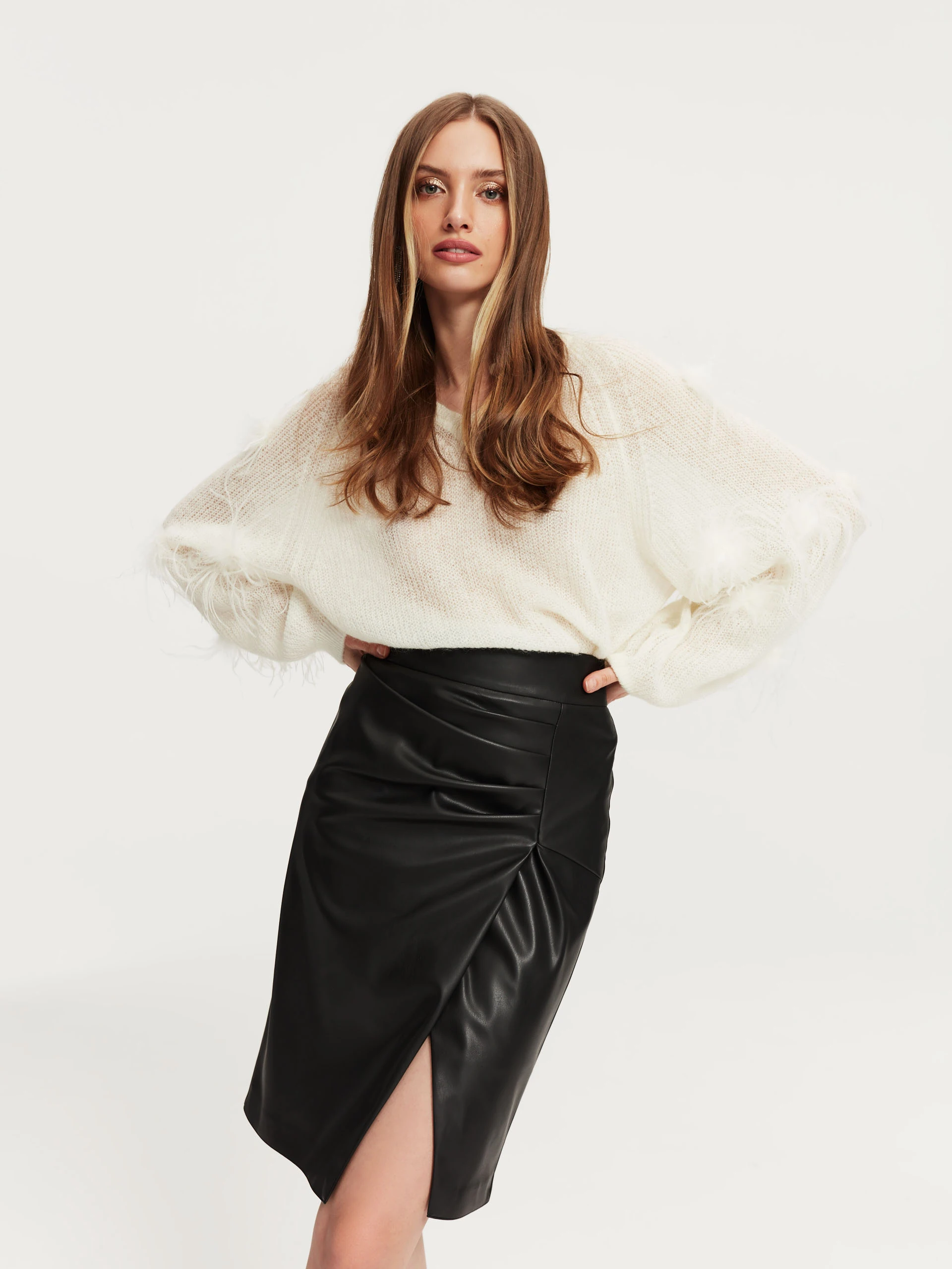 Beige sweater with ostrich feathers