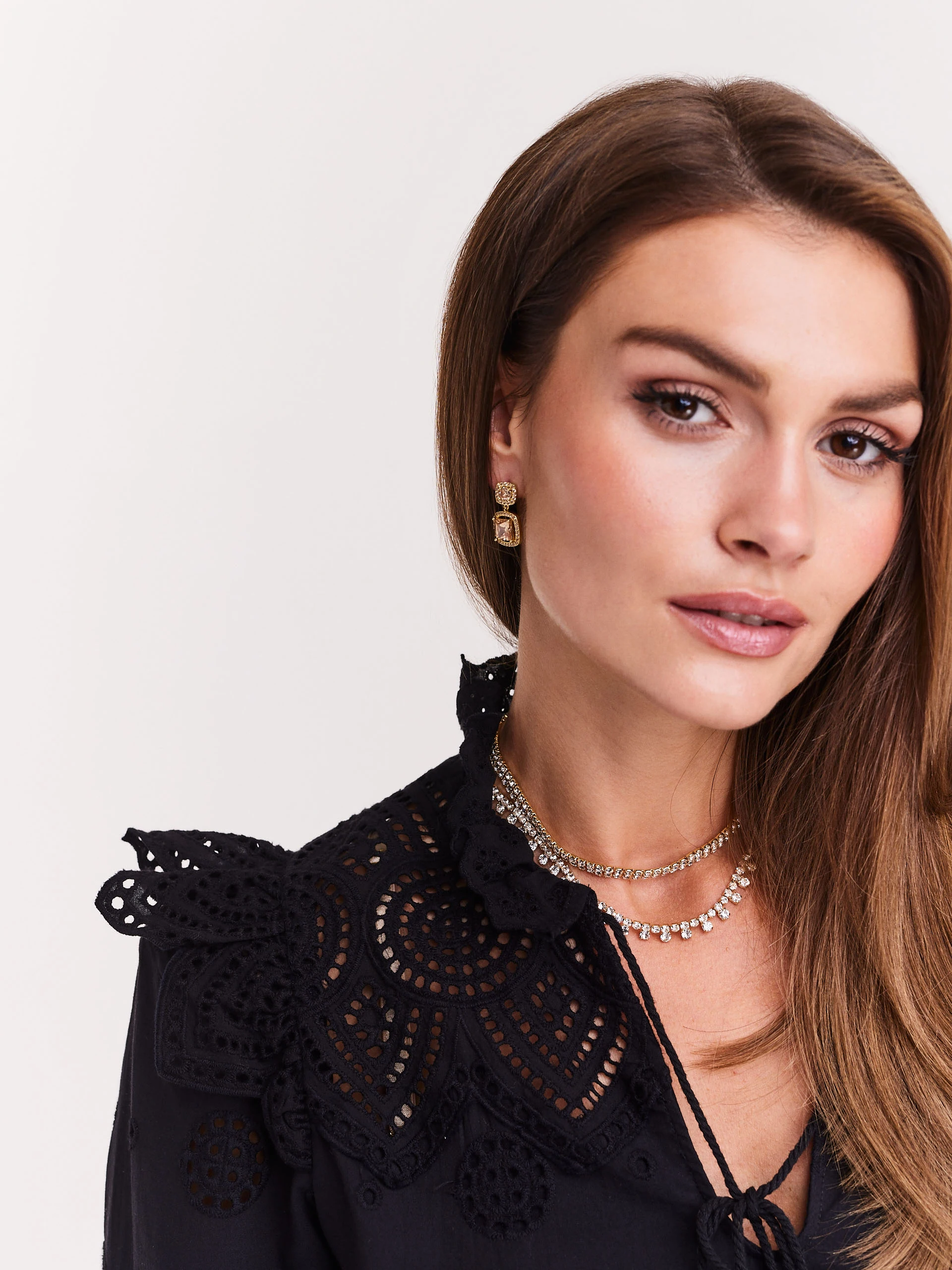 Black blouse with openwork inserts