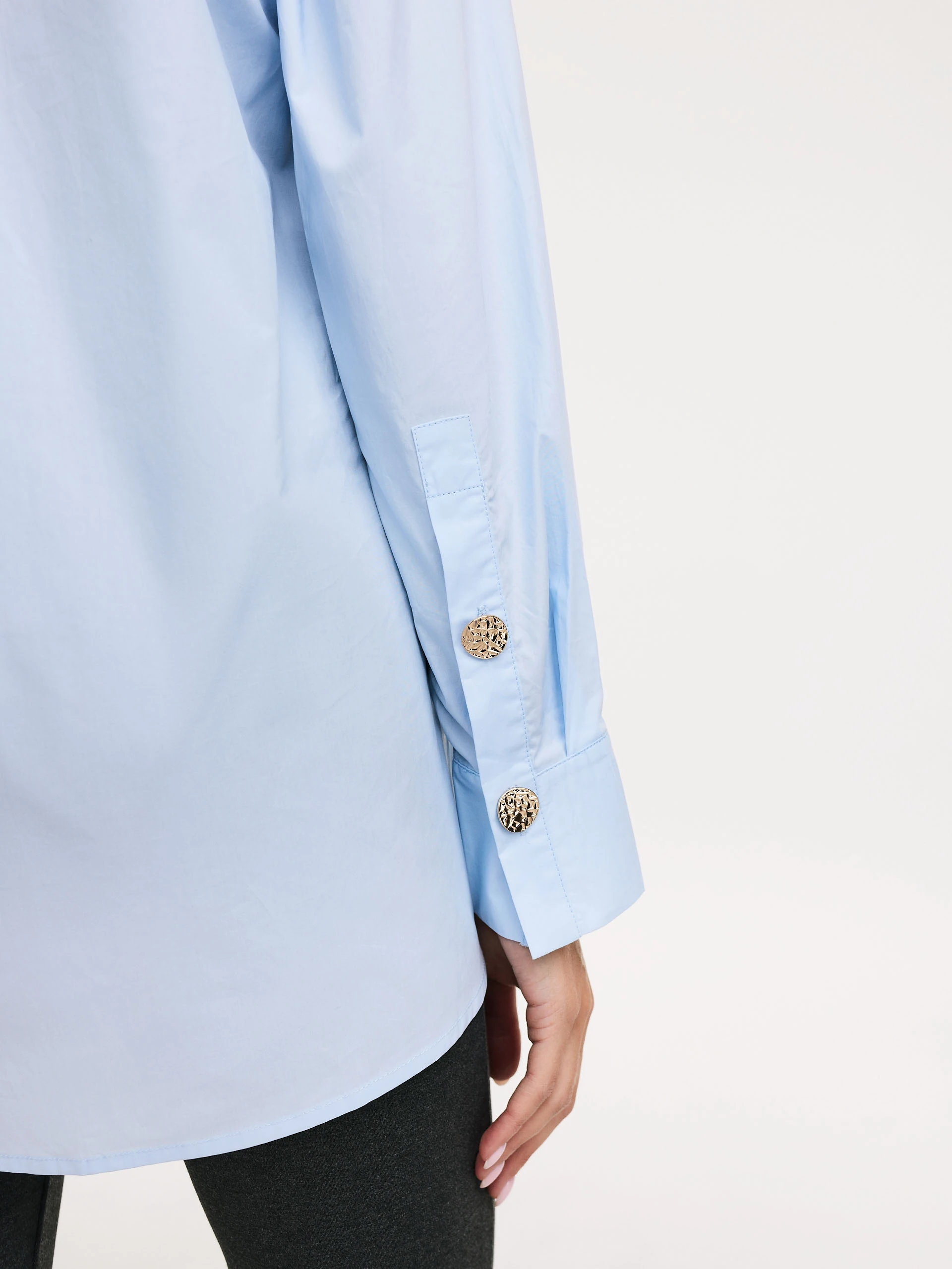 Blue shirt with decorative buttons