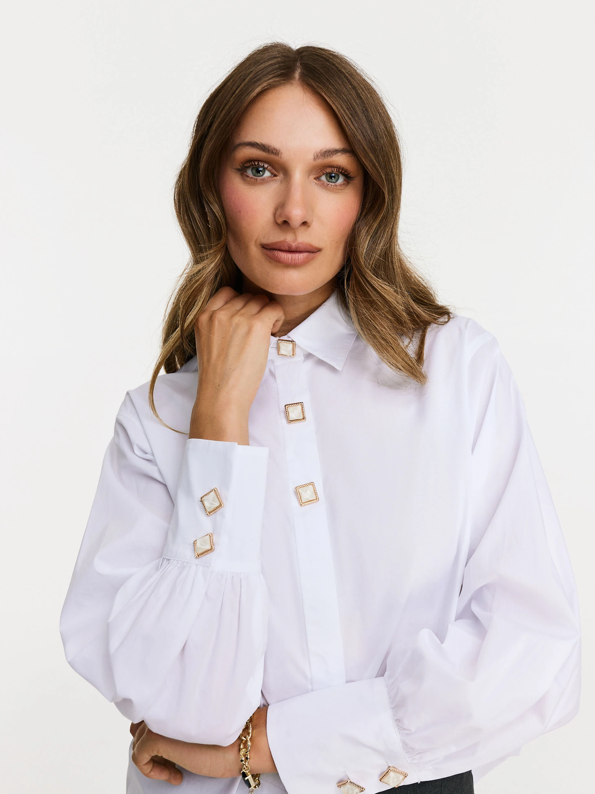 White shirt with decorative buttons
