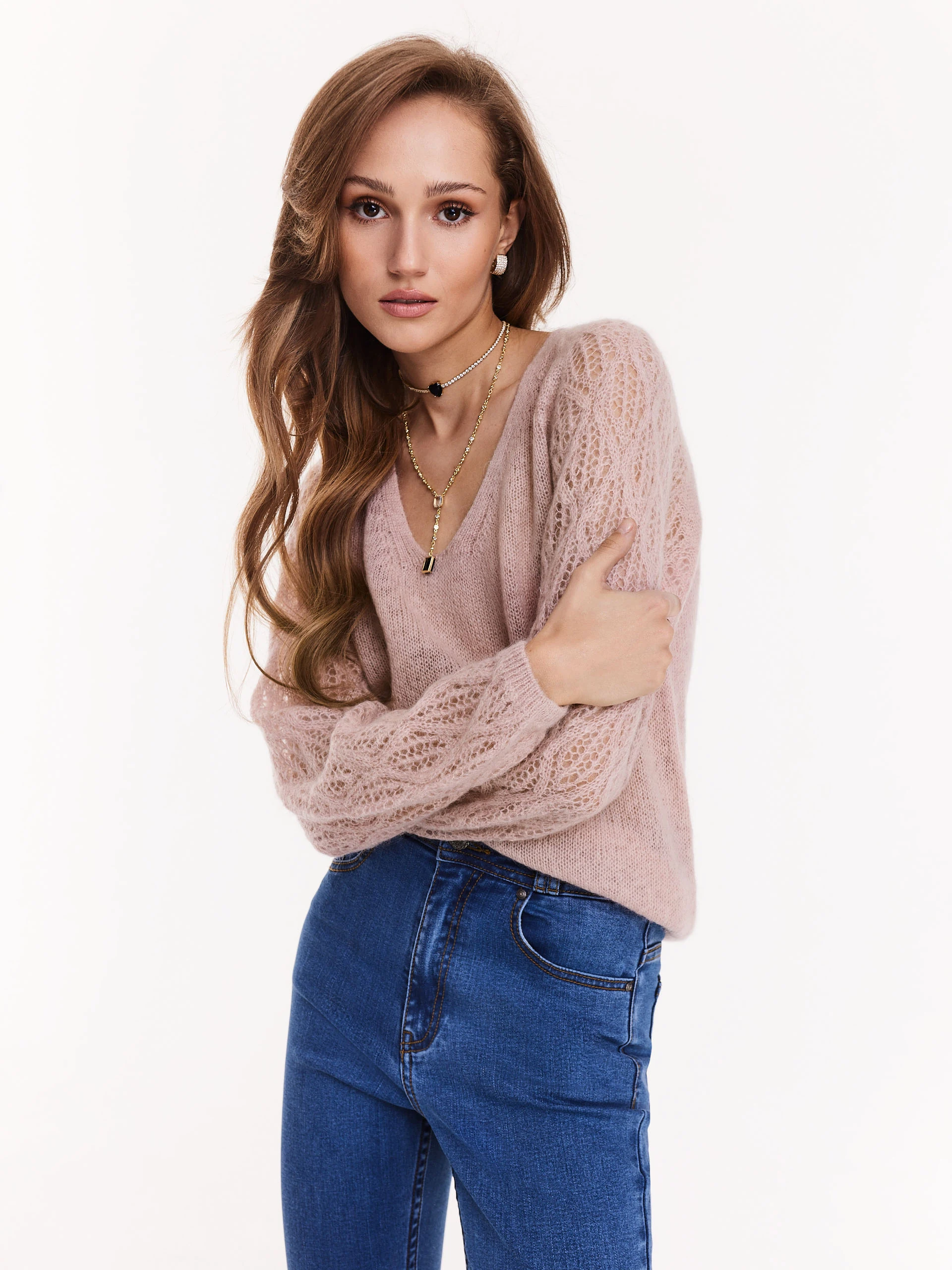 Pink sweater with openwork sleeves