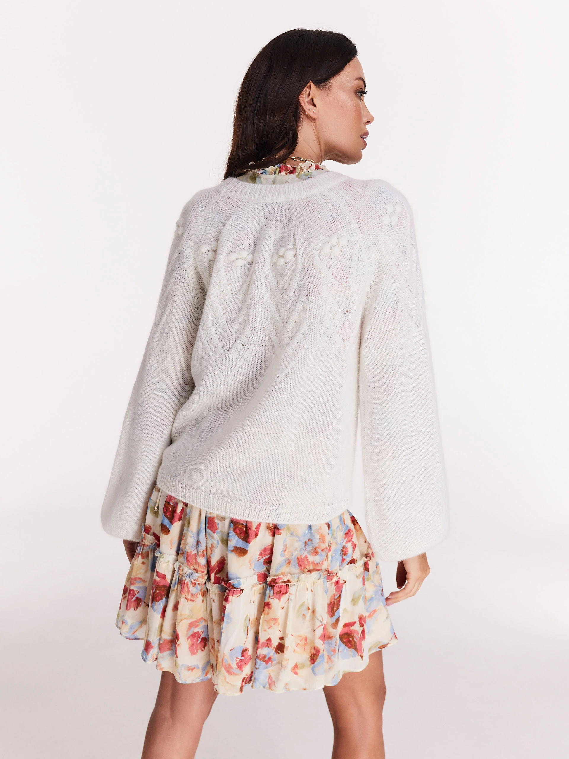 Loose white sweater with round neckline