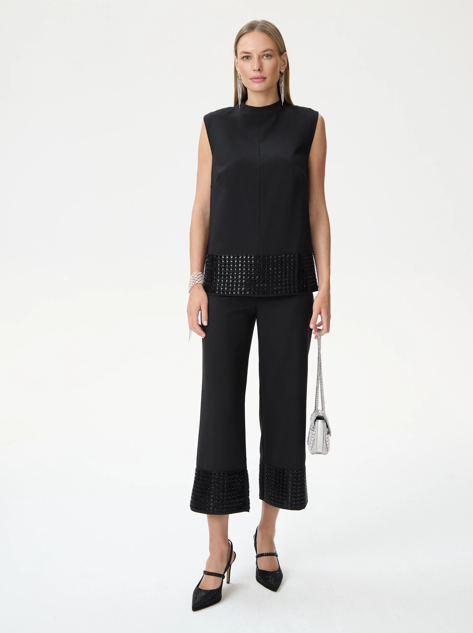 Black sleeveless blouse with decorative trim