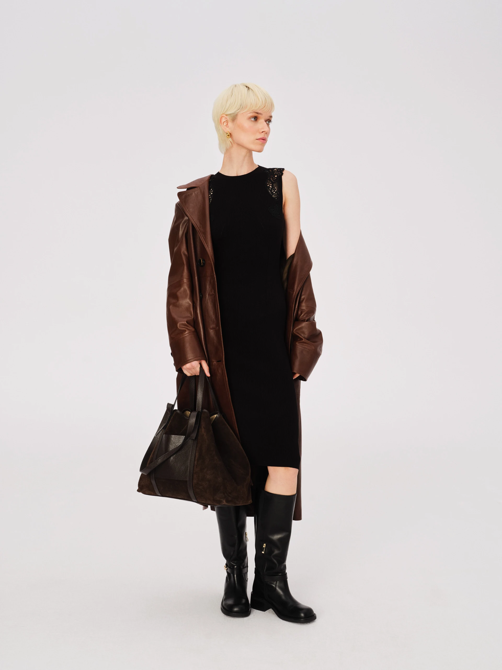 Black fitted dress with openwork inserts