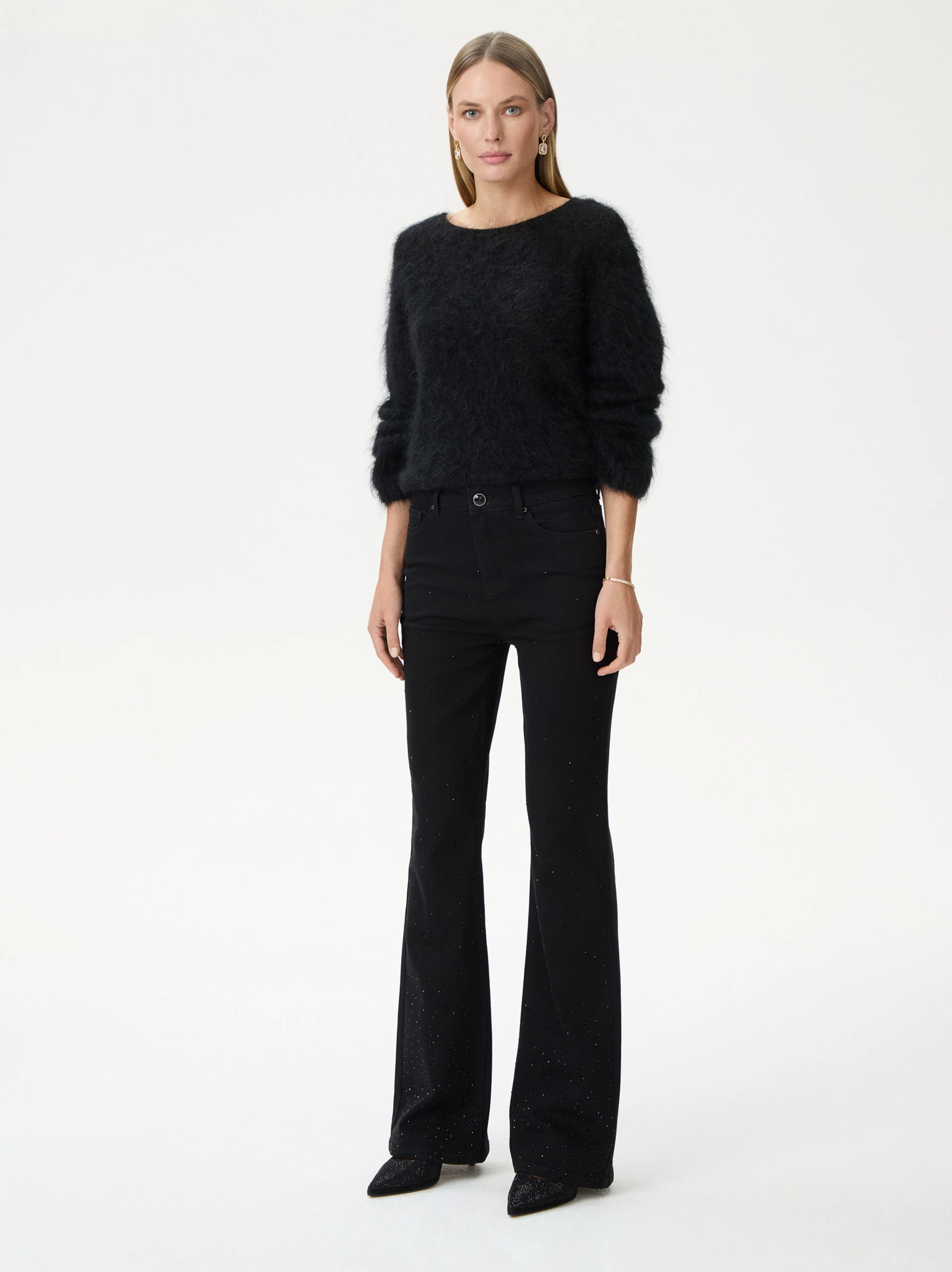 Black bell-bottom pants with shiny detail