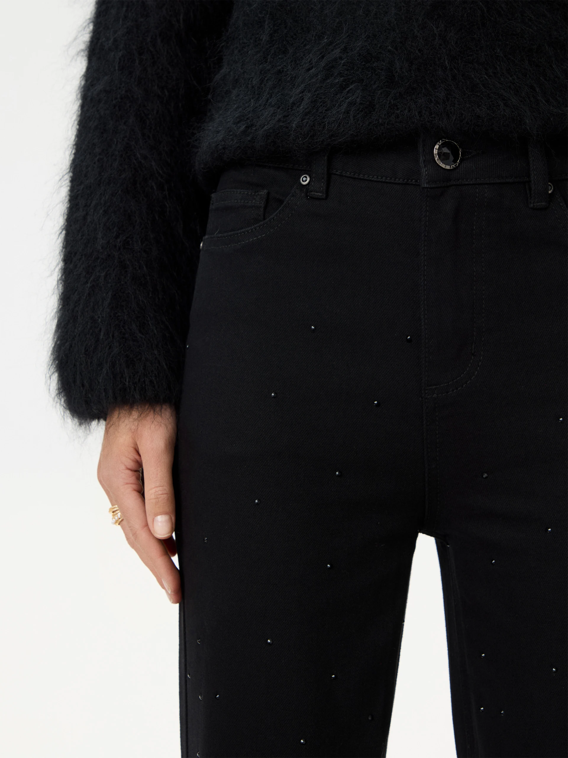 Black bell-bottom pants with shiny detail