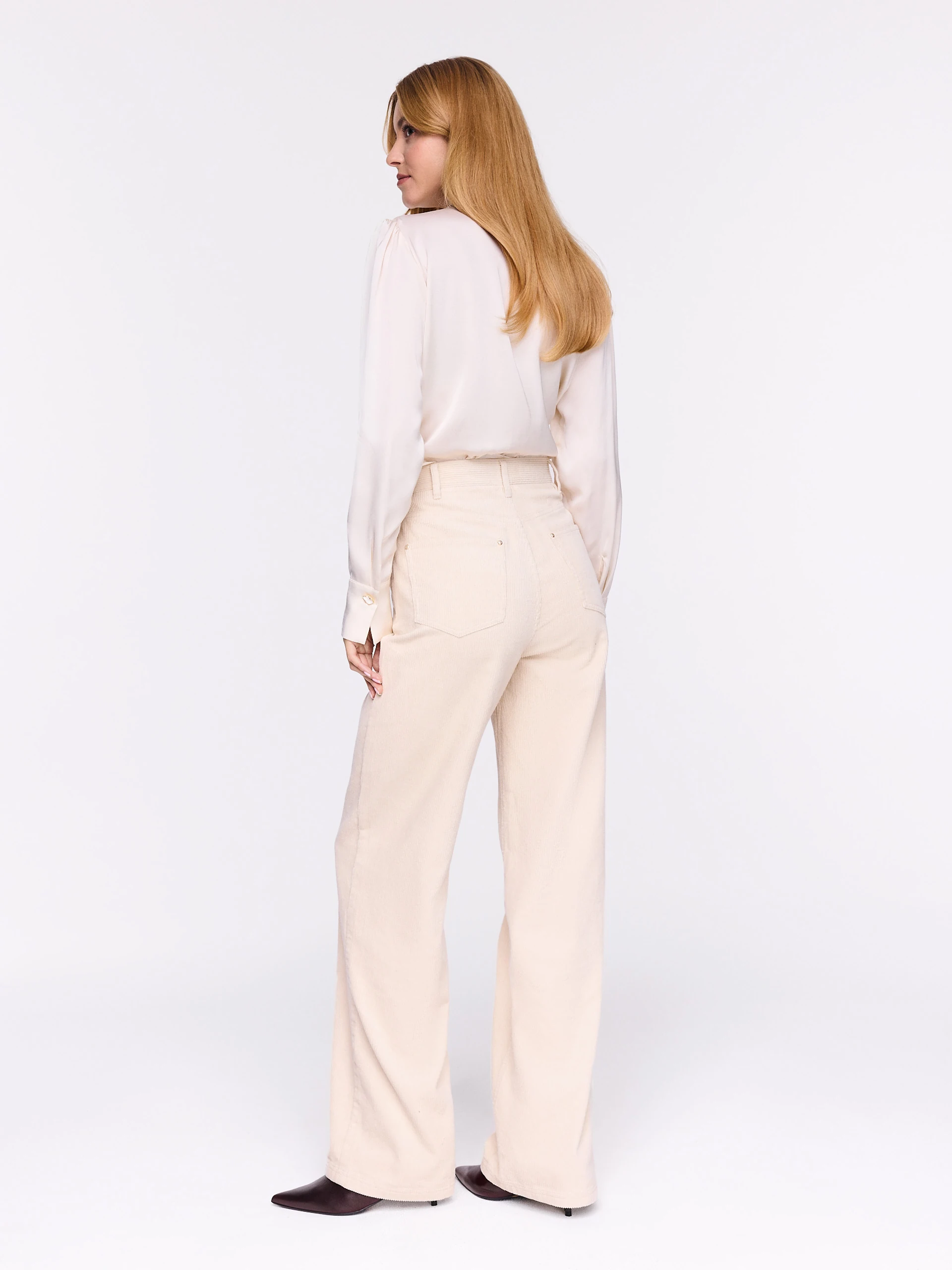 Cream high-waisted corduroy pants