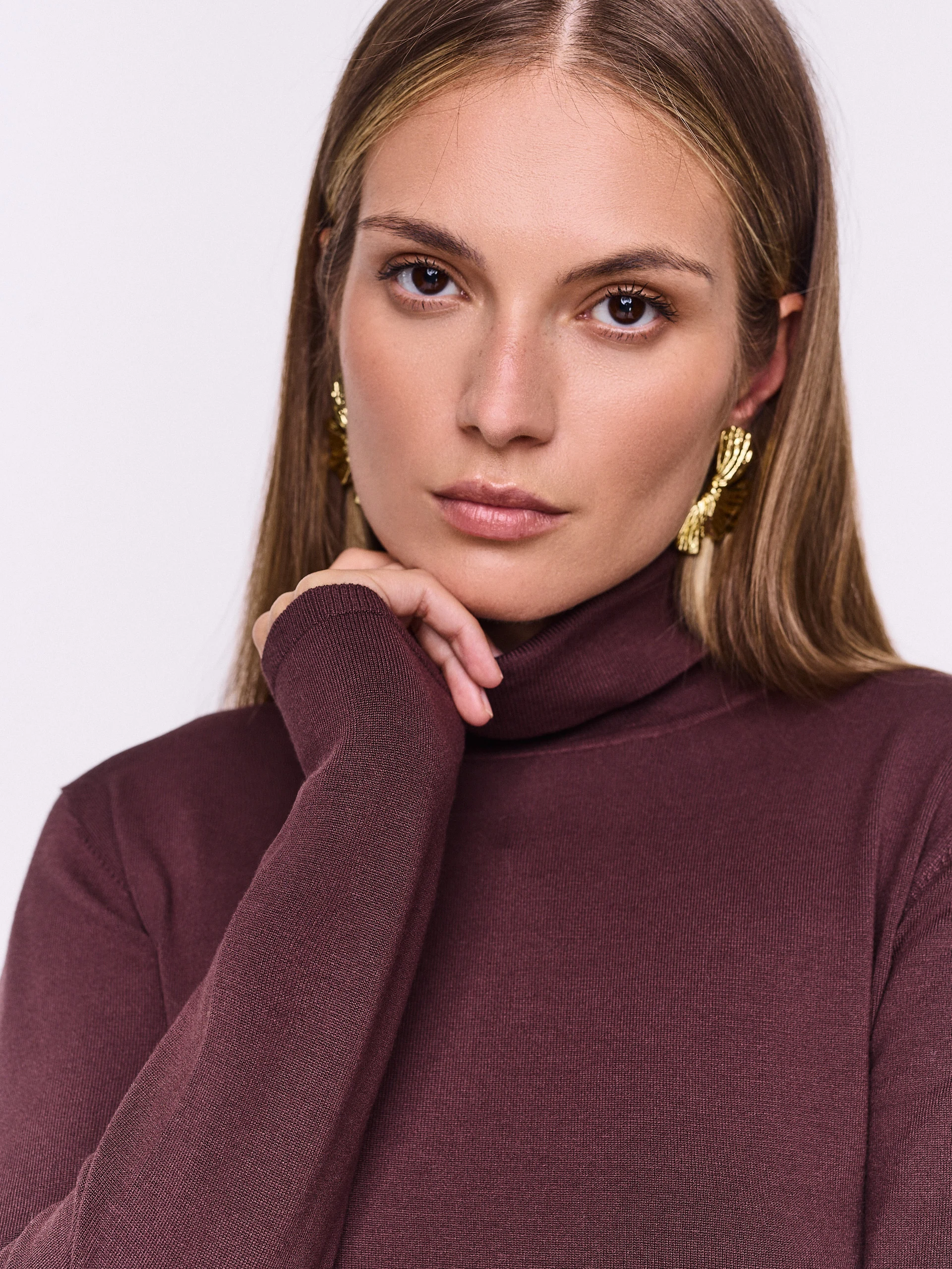 Chocolate-colored turtleneck sweater