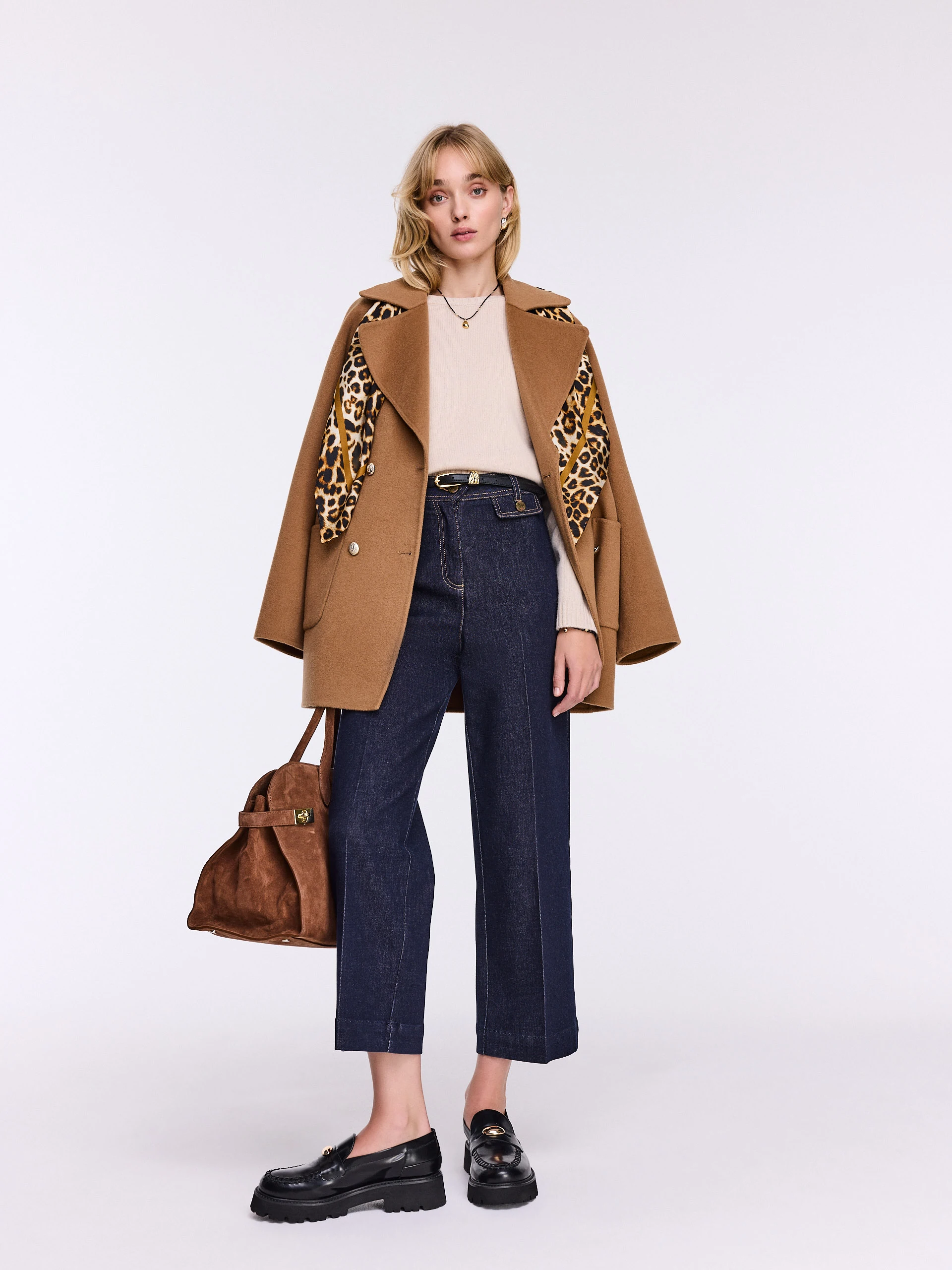 Beige wool sweater with a simple cut