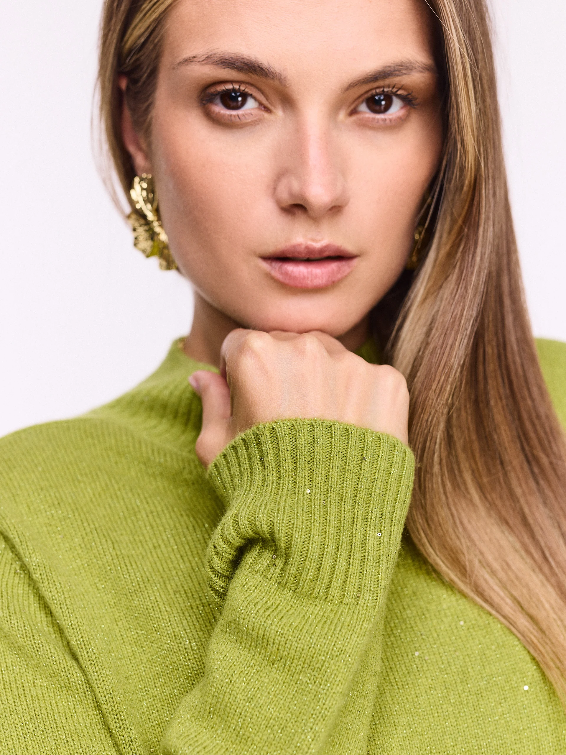 Green wool sweater with shiny flecks