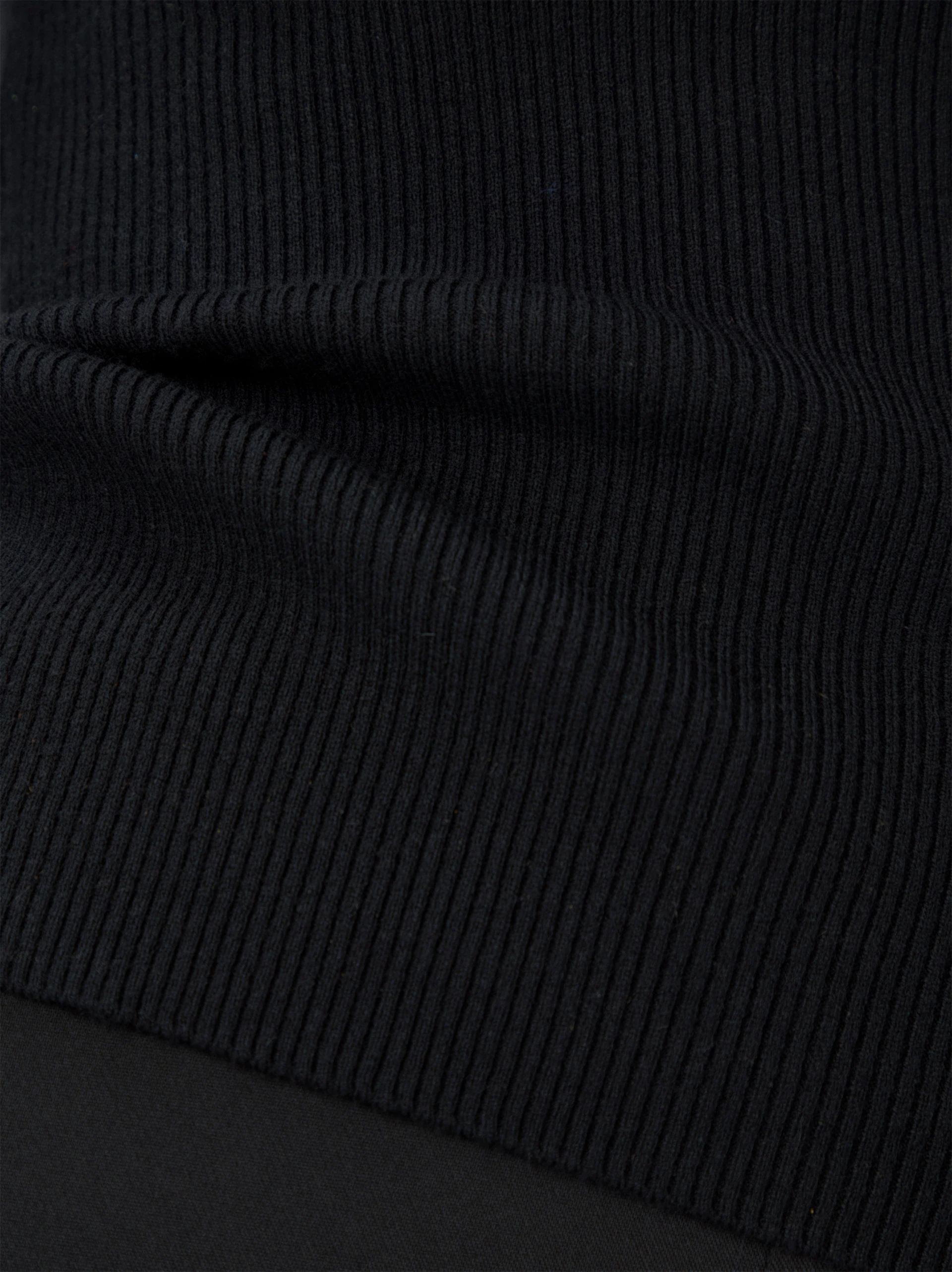 Fitted black ribbed knit sweater