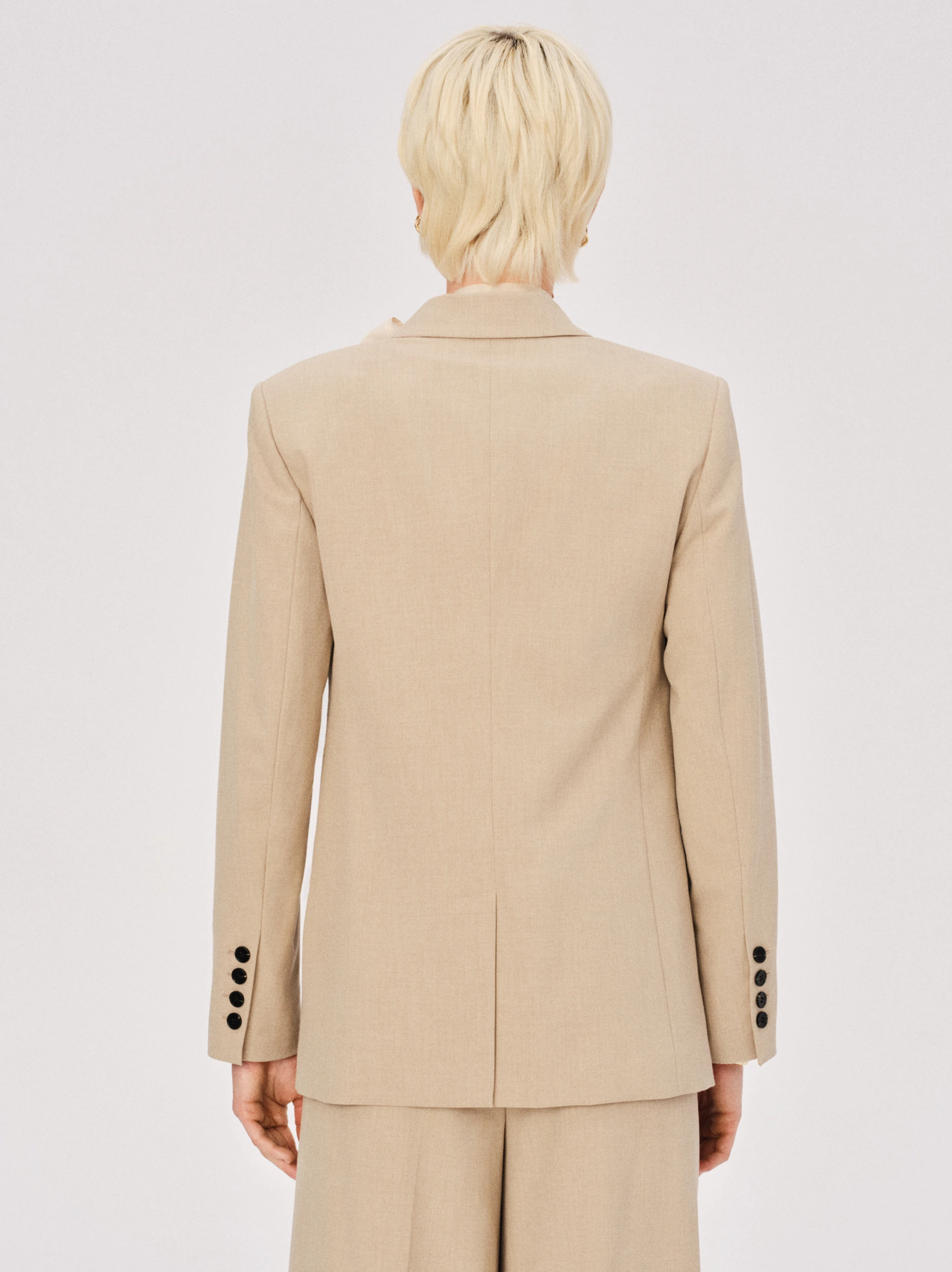 Elegant beige double-breasted jacket