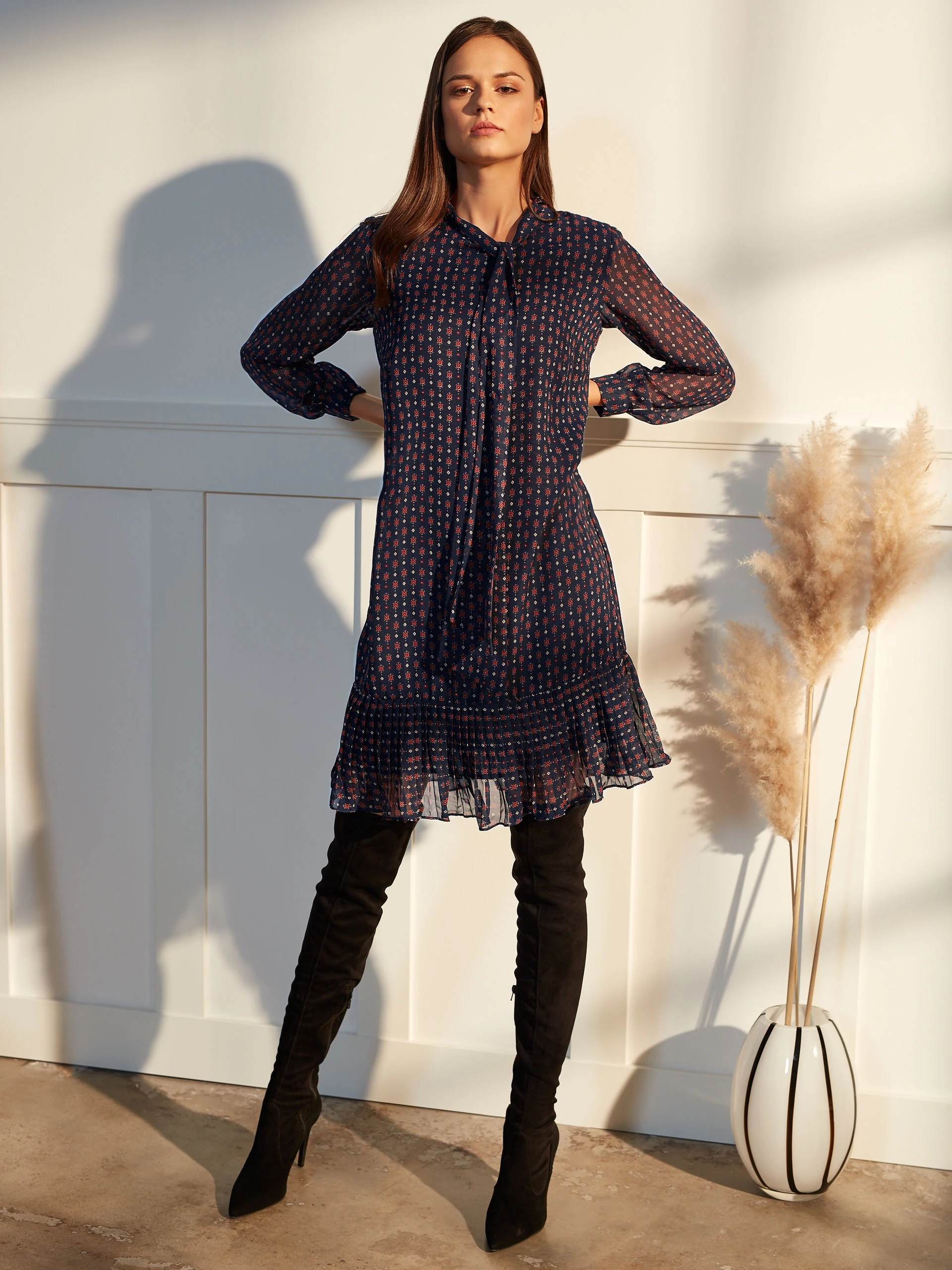 DRESS WITH A RUFFLE AT THE BOTTOM