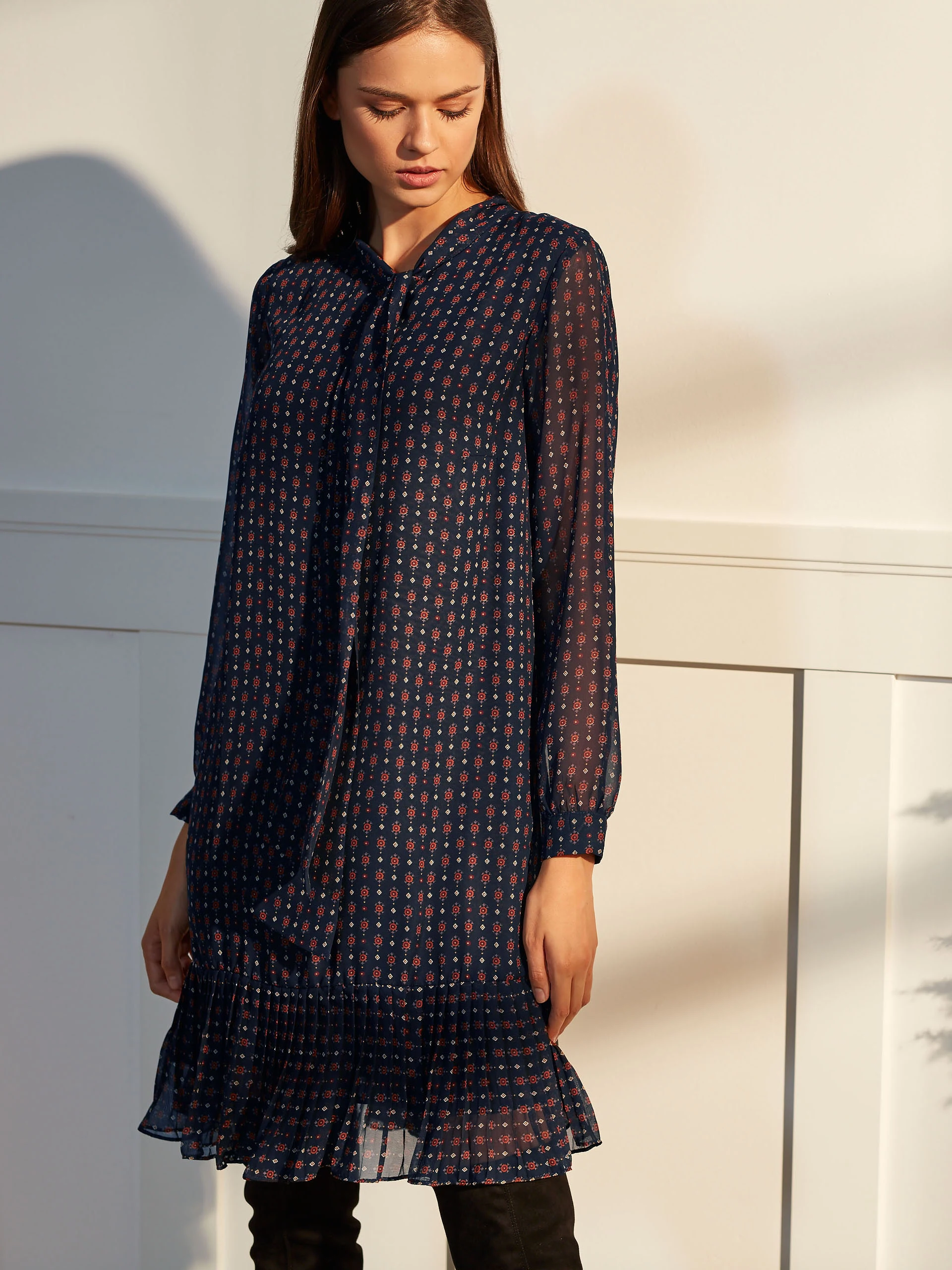 DRESS WITH A RUFFLE AT THE BOTTOM