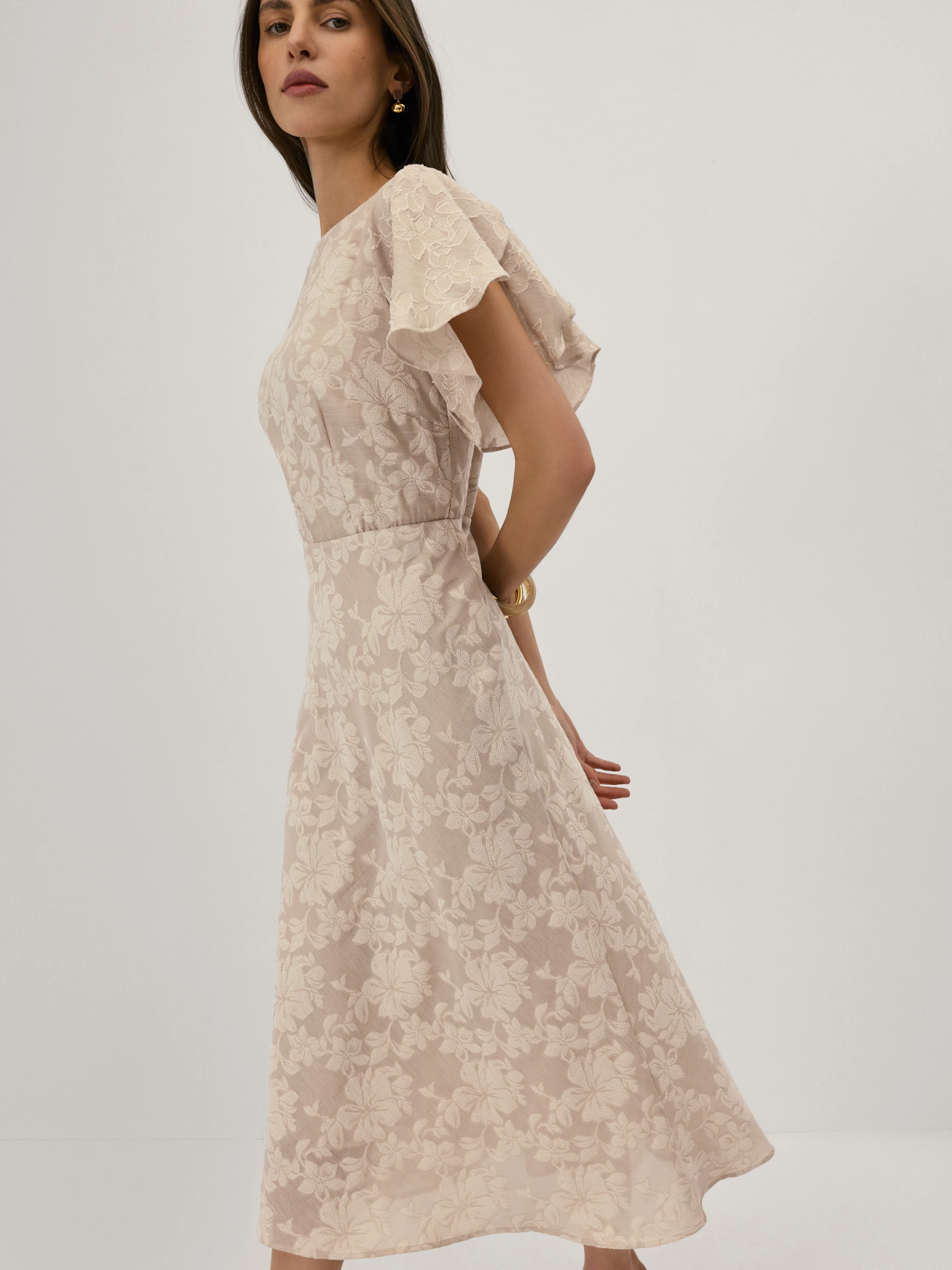 Beige midi dress with a jacquard pattern