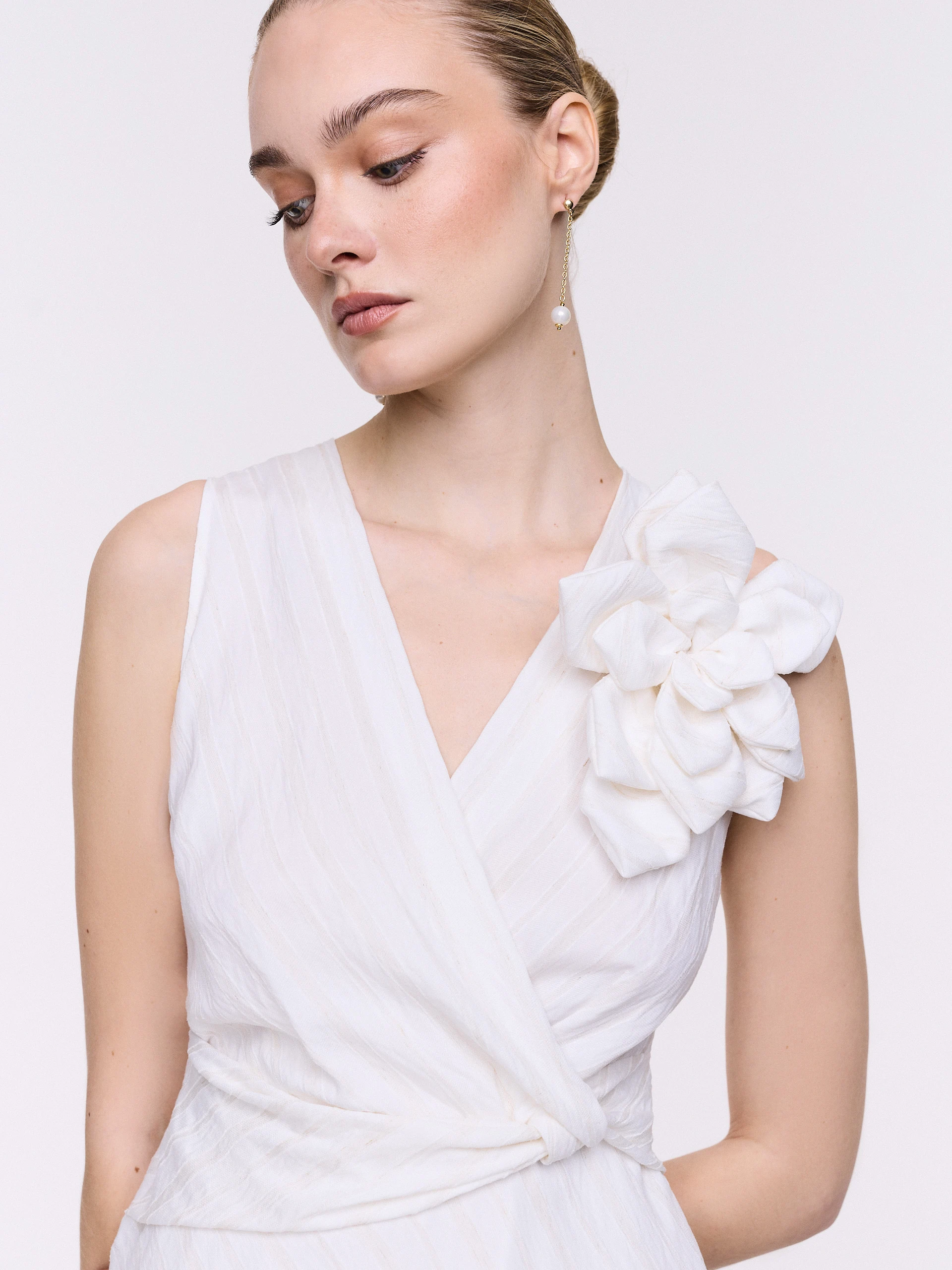 An elegant white midi dress with linen