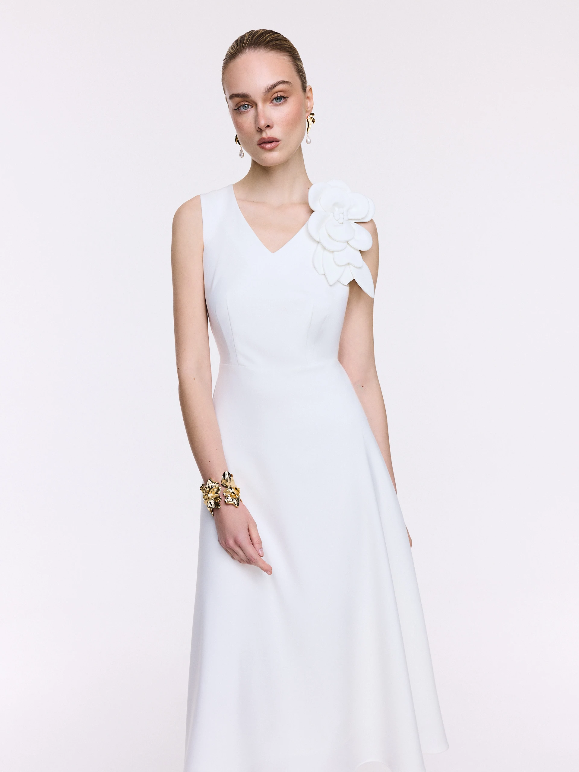 White midi dress with a decorative flower