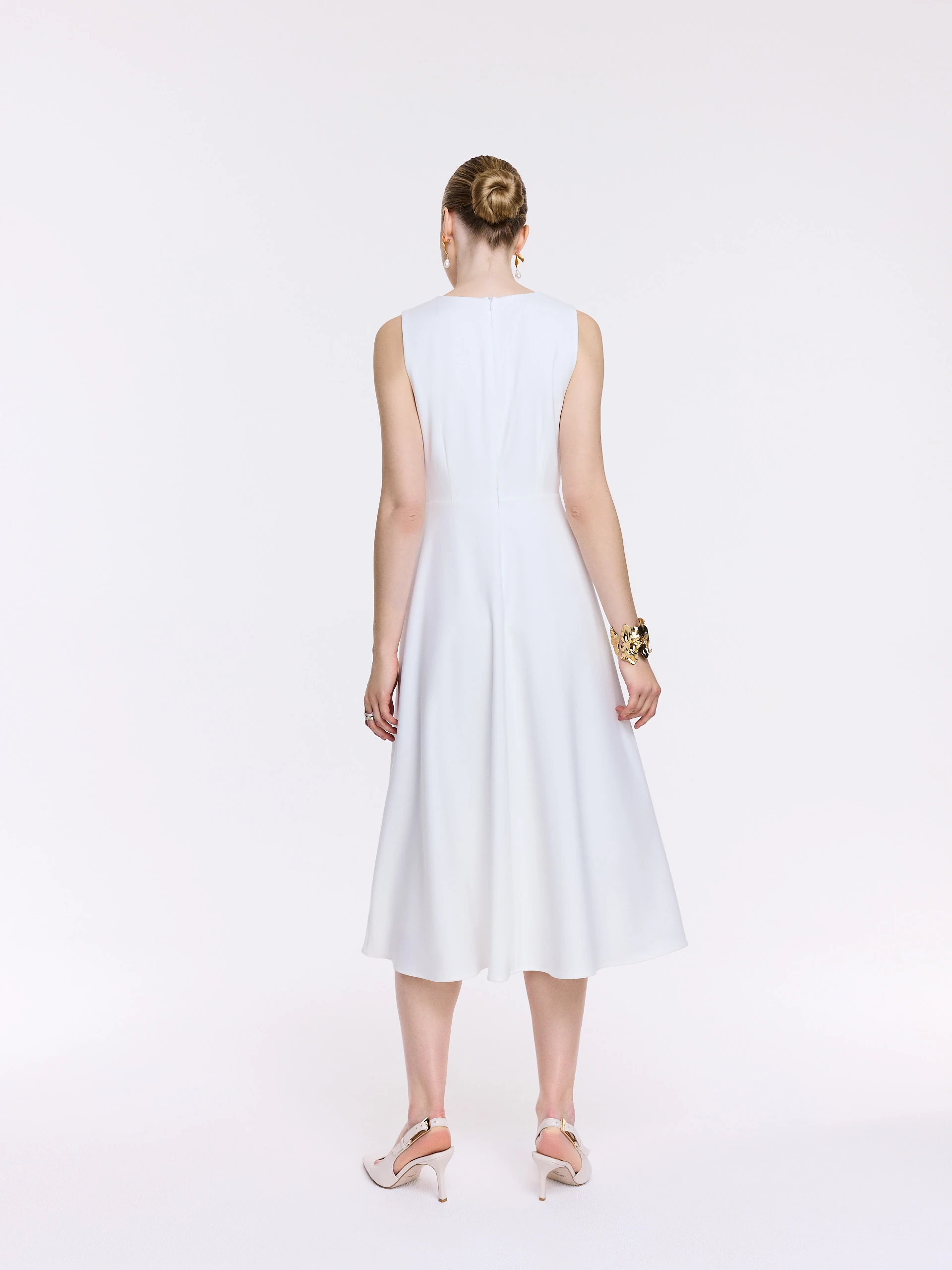 White midi dress with a decorative flower