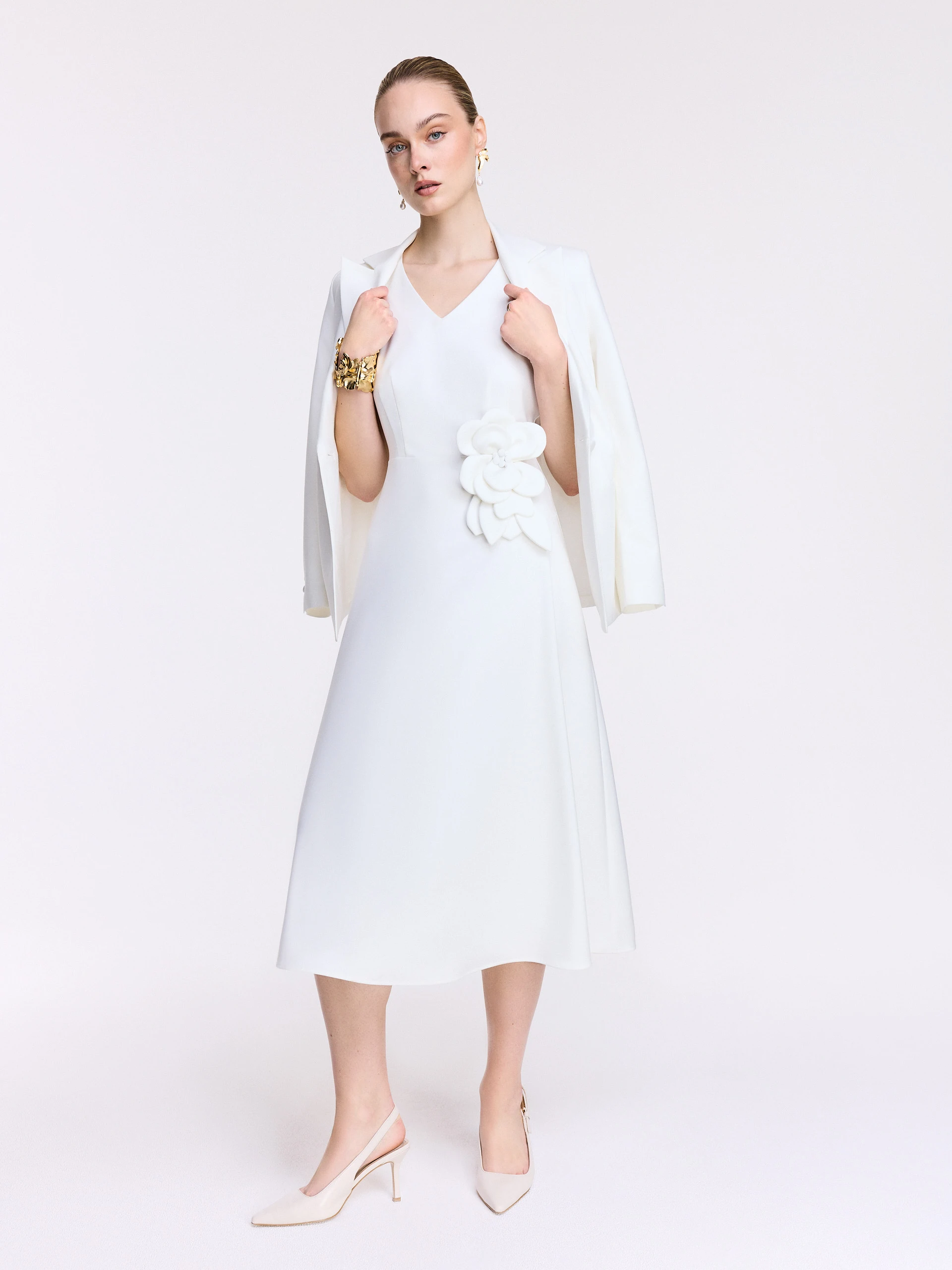 White midi dress with a decorative flower