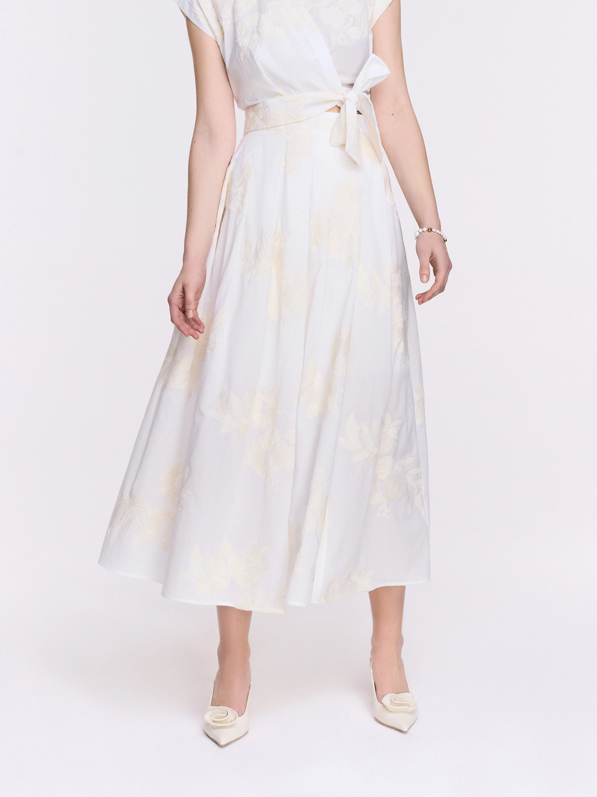High-waisted cream-colored embroidered skirt